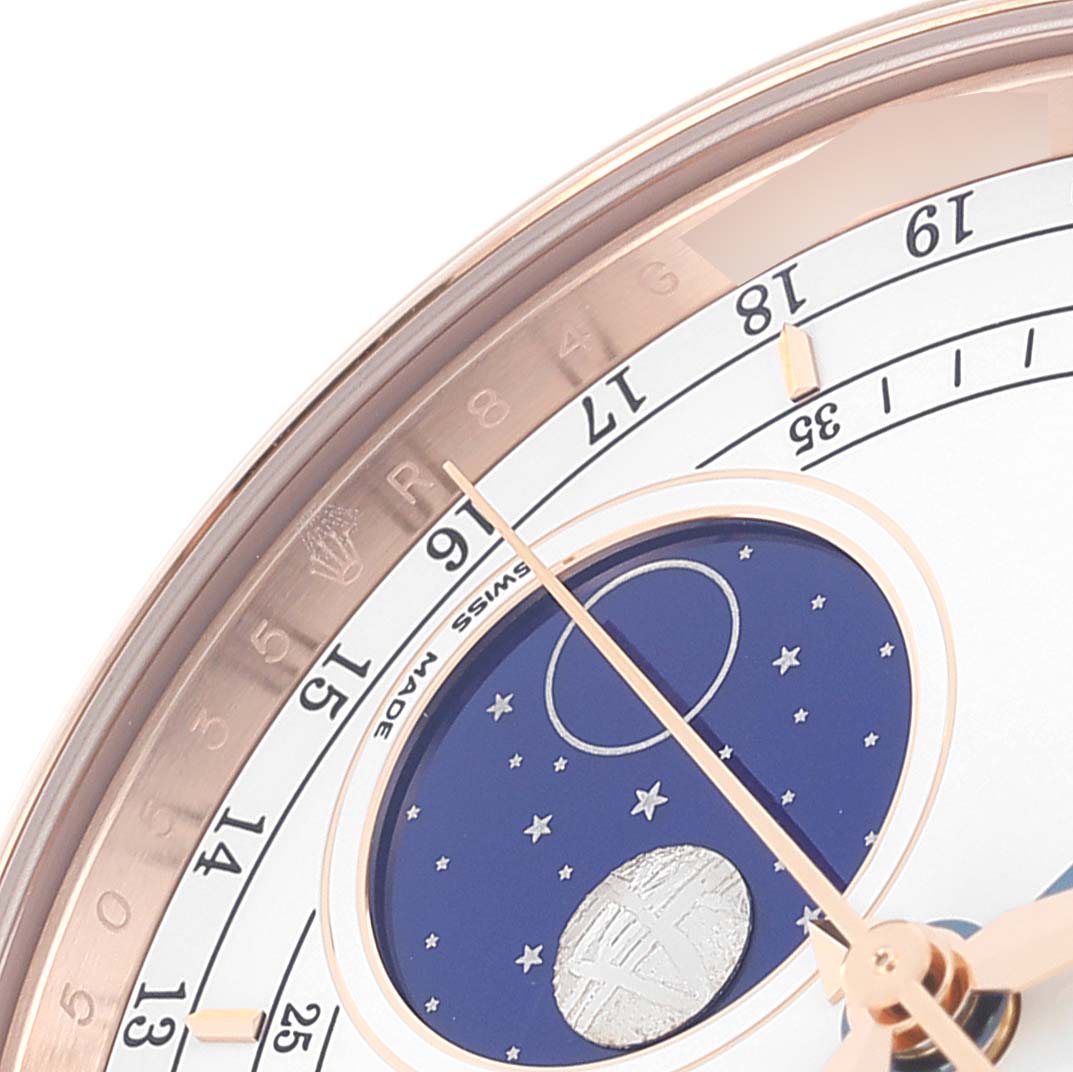 The image shows a close-up of the dial on the Rolex Cellini 50535 Men's Rose Gold White Dial 50535 Men's Rose Gold White Dial, highlighting the minute markers, moonphase indicator, and clock hands.