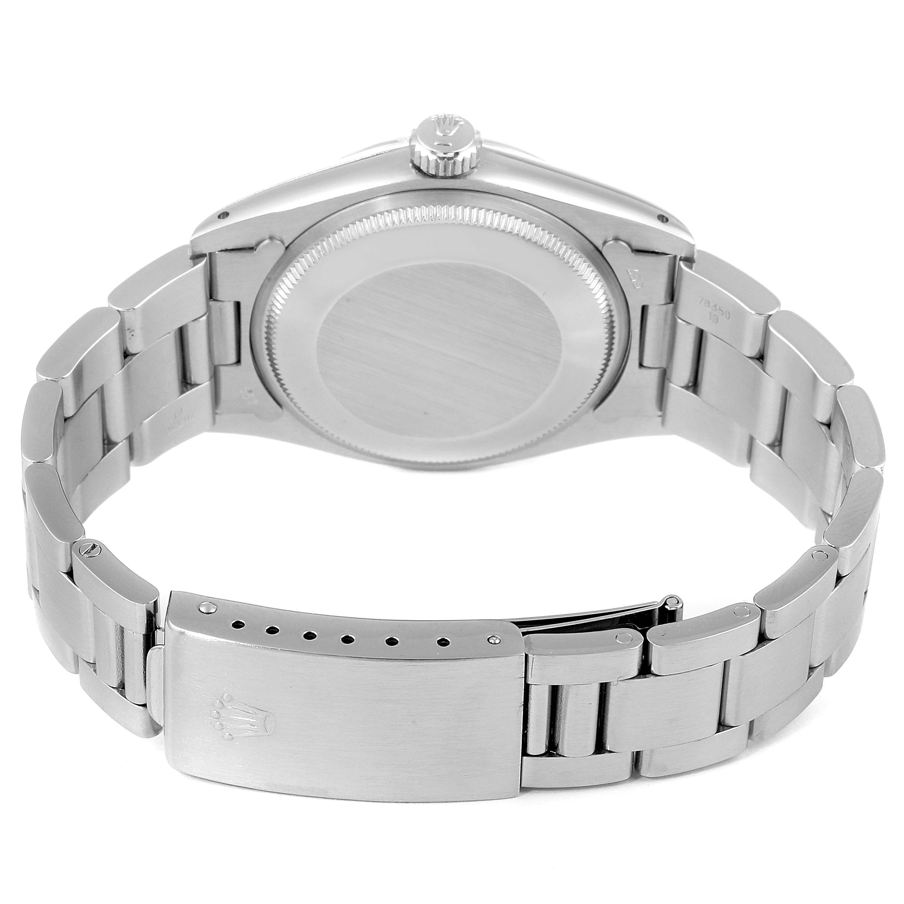 The image shows the backside of a Rolex Vintage Collection 1500 Men's Stainless Steel Grey Dial 1500 Men's Stainless Steel Grey Dial watch and its stainless steel bracelet clasp.