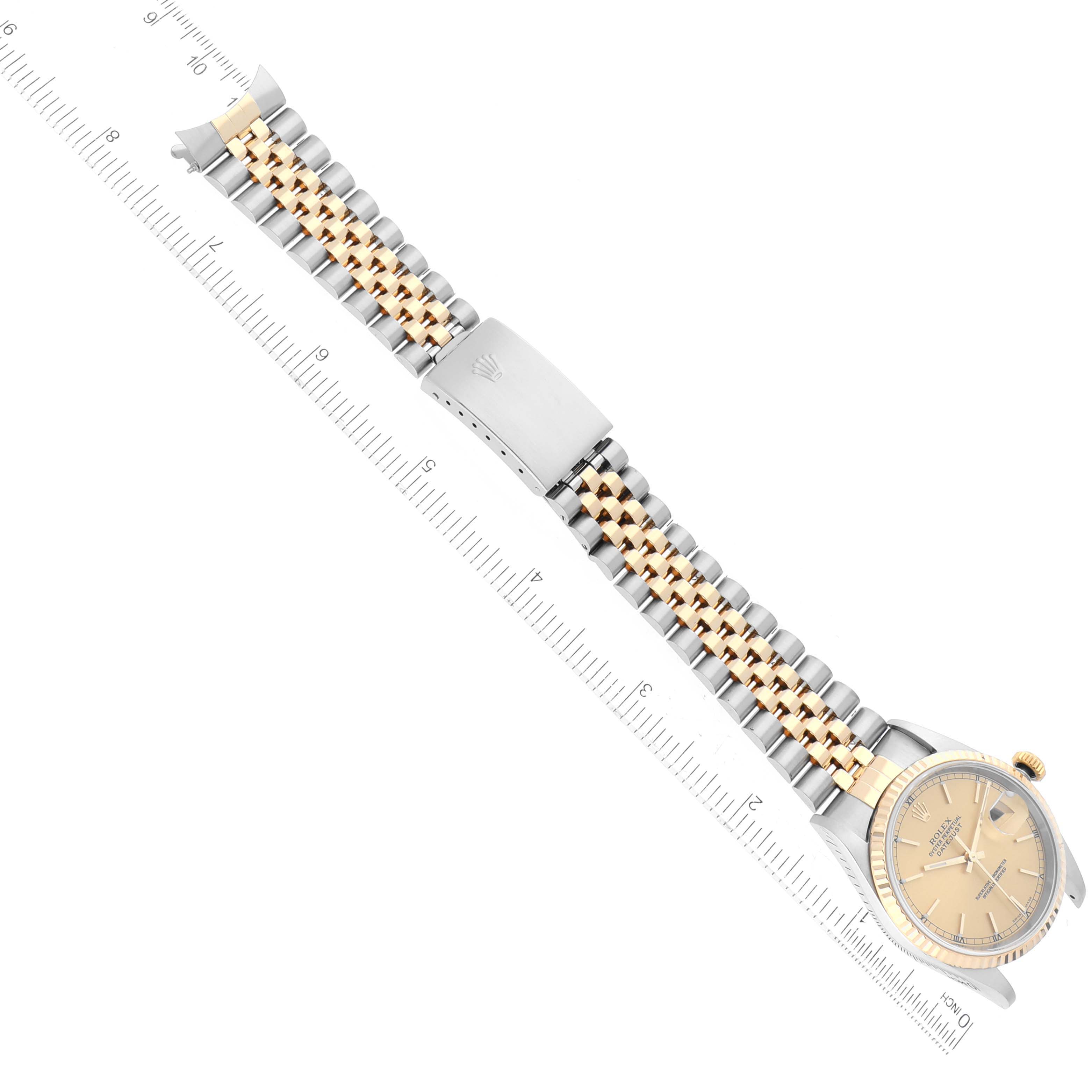 The image shows an overhead view of a Rolex Datejust 16233 Men's Steel and Gold (two tone) Champagne Dial 16233 Men's Steel and Gold (two tone) Champagne Dial watch, focusing on its face, bezel, and two-tone bracelet with a clasp.