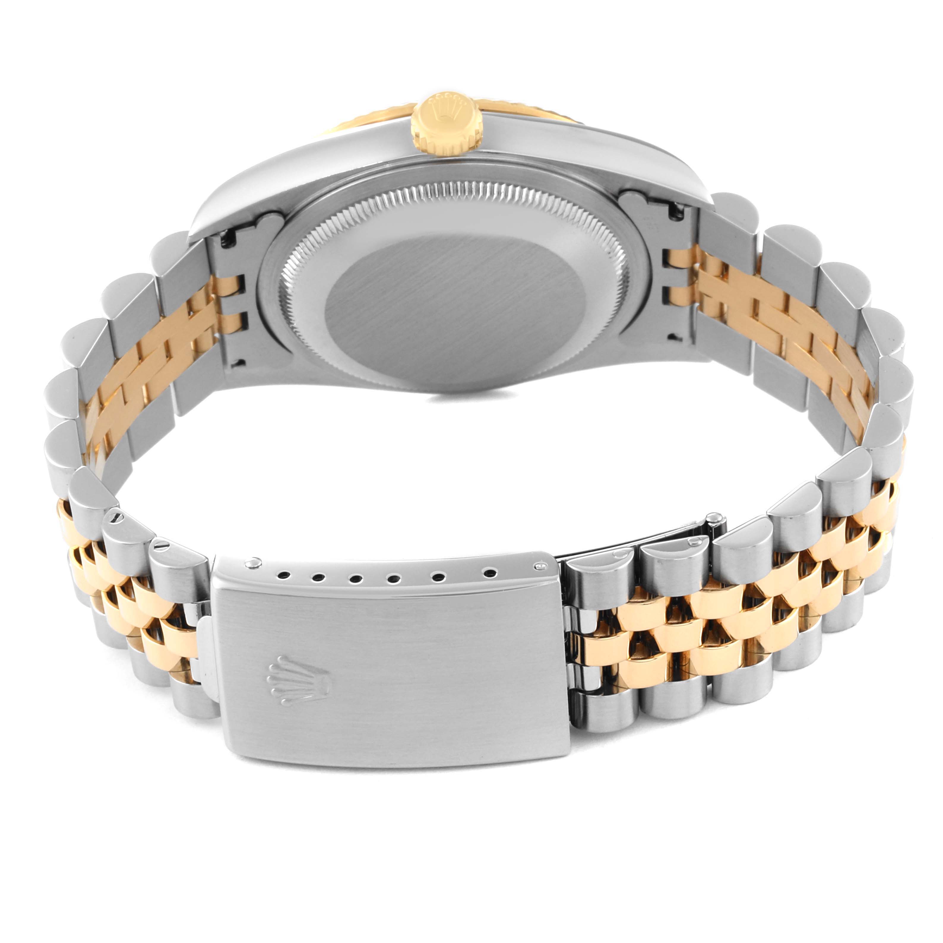 This image shows the back case and clasp of a Rolex Datejust 16233 Men's Steel and Gold (two tone) Champagne Dial 16233 Men's Steel and Gold (two tone) Champagne Dial watch, highlighting its two-tone bracelet.