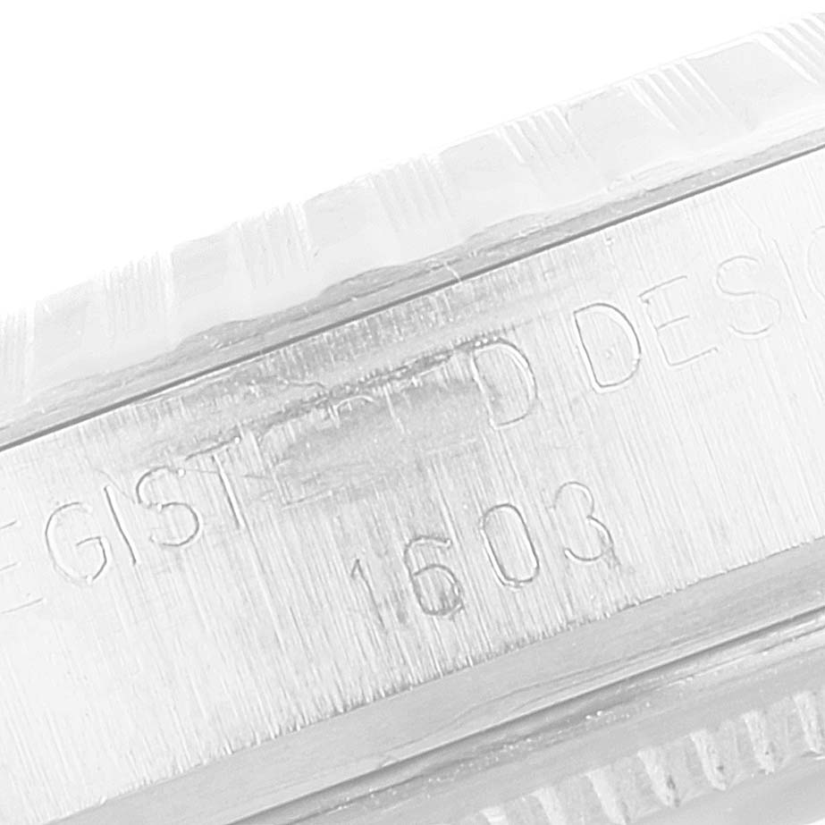 The image shows a close-up angle of the edges of the case and bezel of the Rolex Vintage Collection 1603 Men's Stainless Steel Blue Dial 1603 Men's Stainless Steel Blue Dial model 1603.