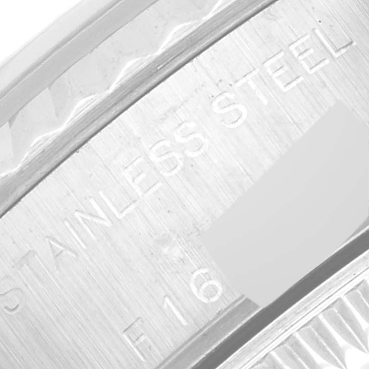 This close-up image shows part of the stainless steel case back of a Rolex Datejust 79174 Women's Stainless Steel Blue Dial 79174 Women's Stainless Steel Blue Dial watch.