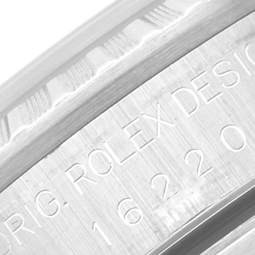 The image shows a close-up of the engraving details on the case side of a Rolex Datejust 16220 Men's Stainless Steel Black Dial 16220 Men's Stainless Steel Black Dial watch.