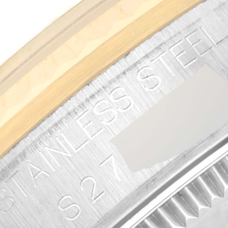 The image shows a close-up of the side bezel and the stainless steel case back of the Rolex Mid-Size 68273 Women's Steel and Gold (two tone) Champagne Dial 68273 Women's Steel and Gold (two tone) Champagne Dial model watch.