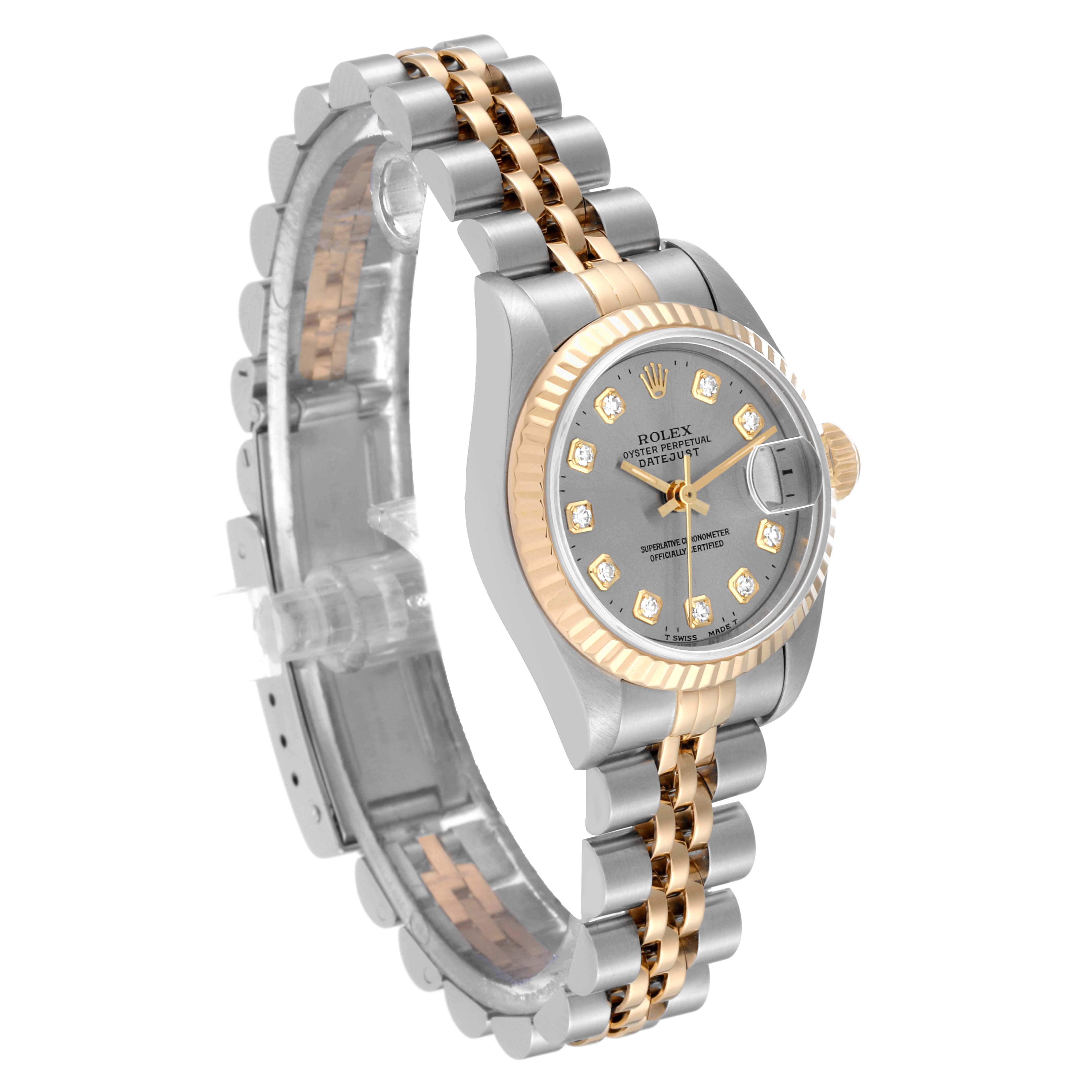 The Rolex Datejust 69173 Women's Steel and Gold (two tone) Grey Dial 69173 Women's Steel and Gold (two tone) Grey Dial watch is shown at an angled side view, highlighting its gold and silver strap, bezel, and grey dial with diamond hour markers.