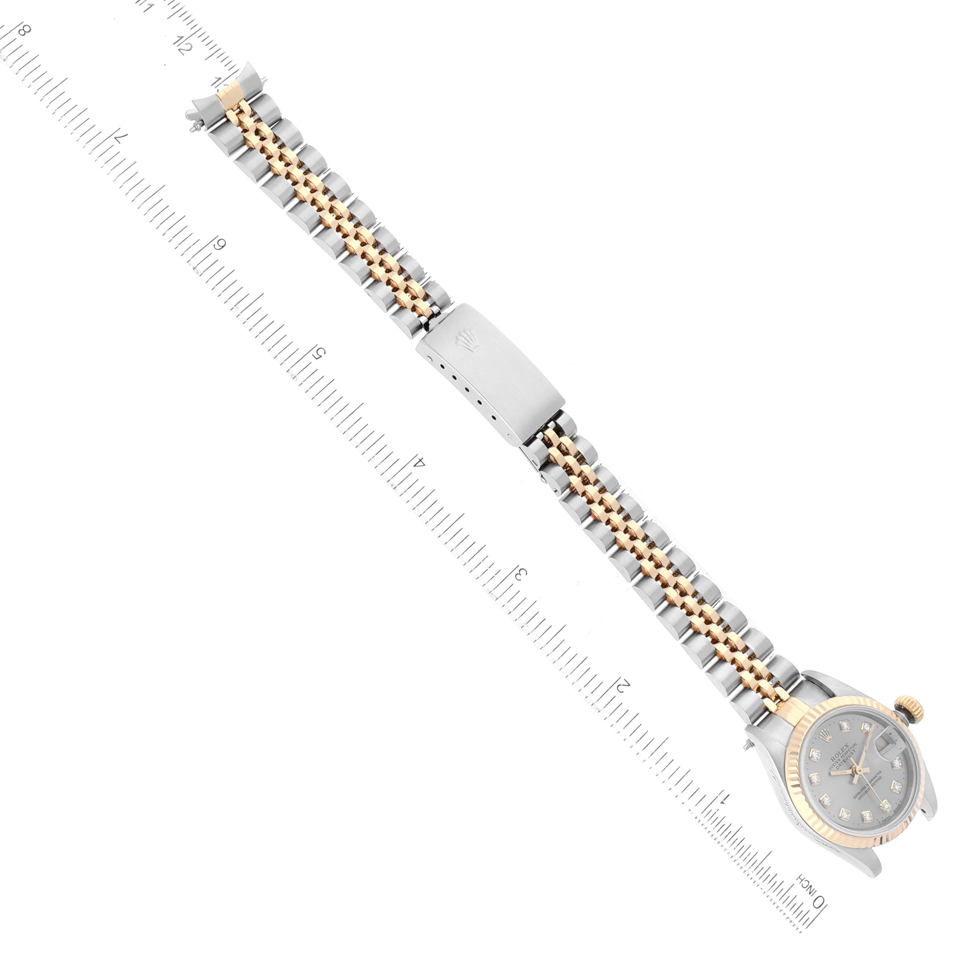 The image shows a Rolex Datejust 69173 Women's Steel and Gold (two tone) Grey Dial 69173 Women's Steel and Gold (two tone) Grey Dial watch from an overhead angle, highlighting the watch face, bracelet, and clasp against a measuring ruler.