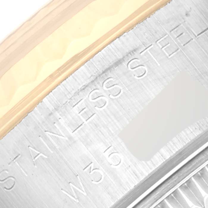 The image shows a close-up of the stainless steel case side with engravings of a Rolex Datejust 69173 Women's Steel and Gold (two tone) Grey Dial 69173 Women's Steel and Gold (two tone) Grey Dial watch.