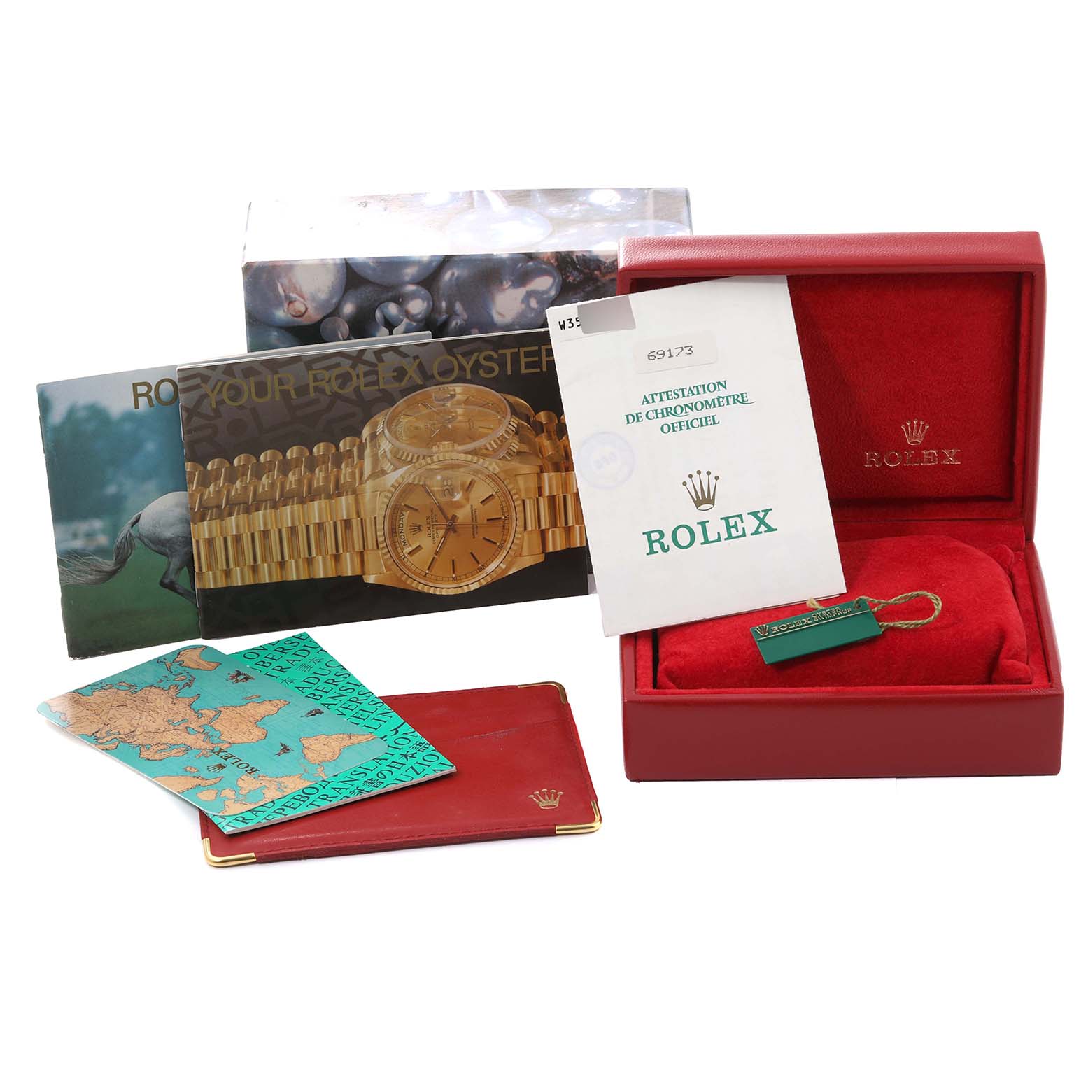 The image shows accessories for a Rolex Datejust 69173 Women's Steel and Gold (two tone) Grey Dial 69173 Women's Steel and Gold (two tone) Grey Dial, including the box, booklet, tags, and paperwork.