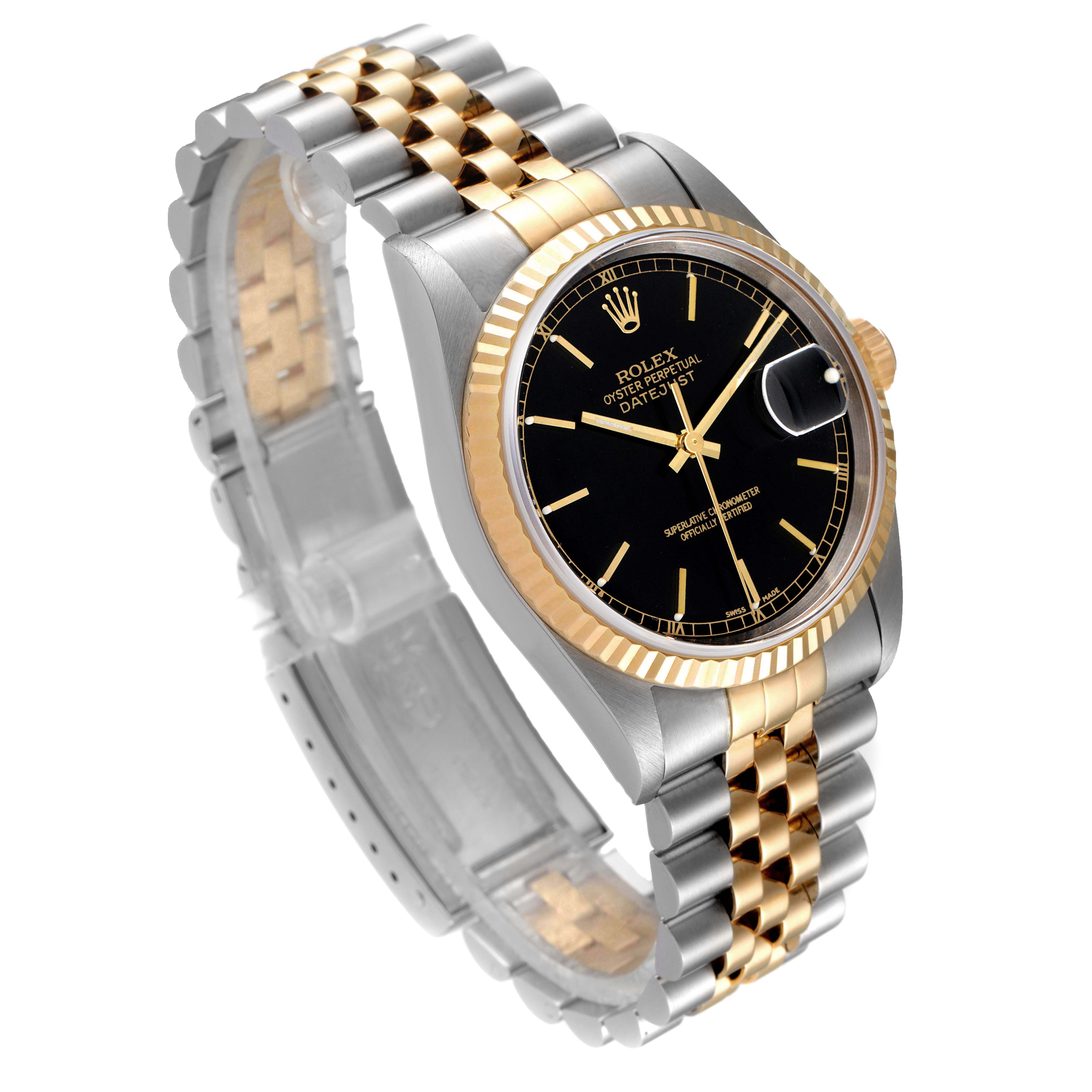 This image shows the Rolex Datejust 16233 Men's Steel and Gold (two tone) Black Dial 16233 Men's Steel and Gold (two tone) Black Dial watch at a three-quarter angle, highlighting its two-tone bracelet, black dial, and fluted bezel.