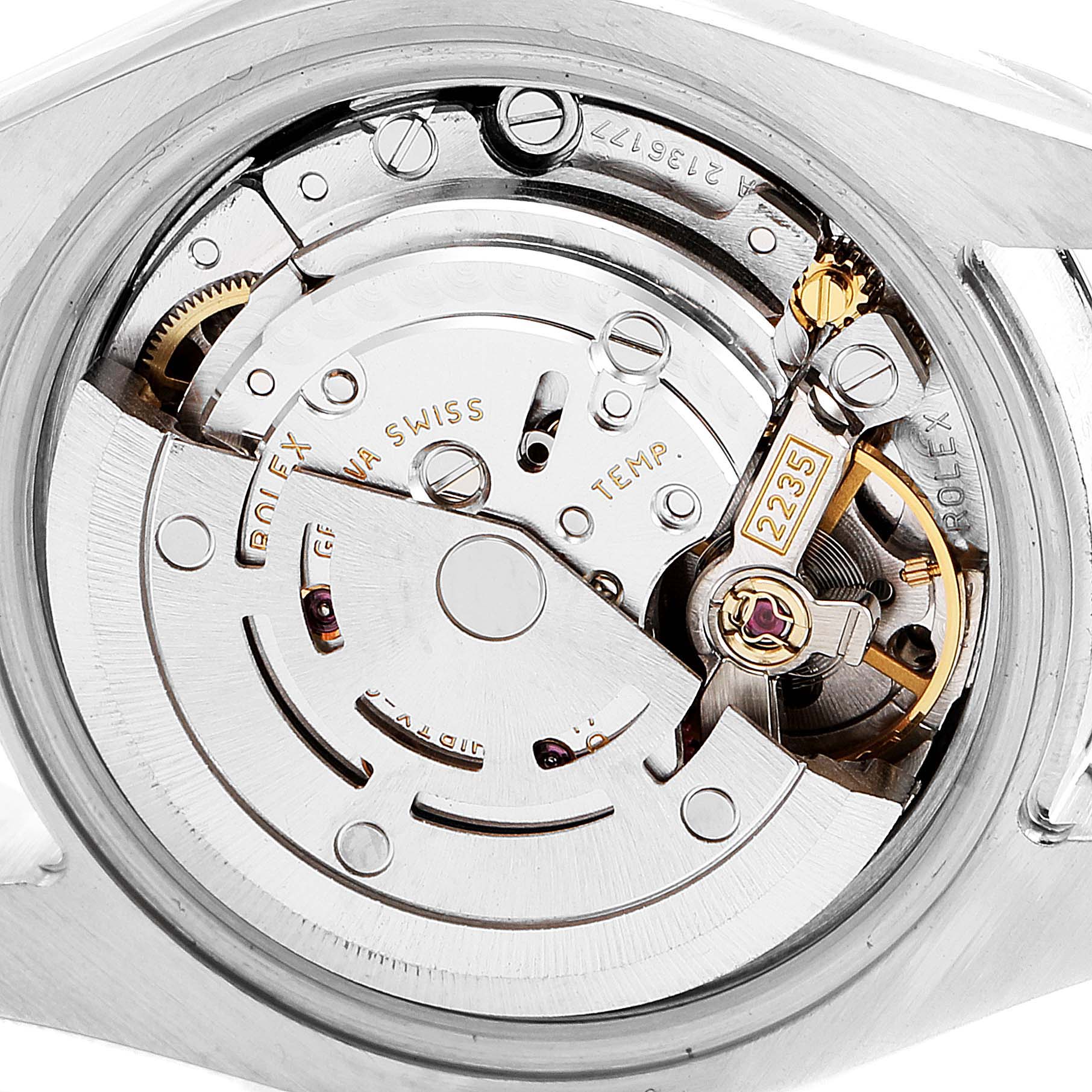 The image shows the intricate movement mechanism of a Rolex Datejust 179171 Women's Steel and Gold (two tone) Black Dial 179171 Women's Steel and Gold (two tone) Black Dial watch from a close-up angle.