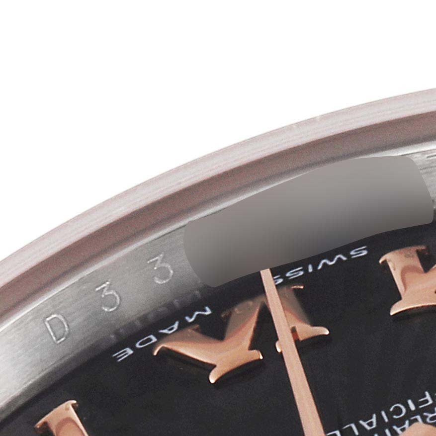 This close-up image shows the bezel edge, part of the dial, and Roman numeral markers of the Rolex Datejust 179171 Women's Steel and Gold (two tone) Black Dial 179171 Women's Steel and Gold (two tone) Black Dial watch.