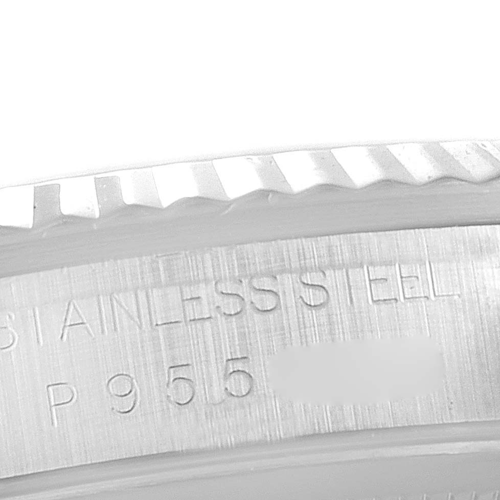 This is a close-up shot of the case back and part of the bezel of a Rolex Datejust 16234 Men
s Stainless Steel Black Dial 16234 Men
s Stainless Steel Black Dial watch, showcasing the "stainless steel" engraving.