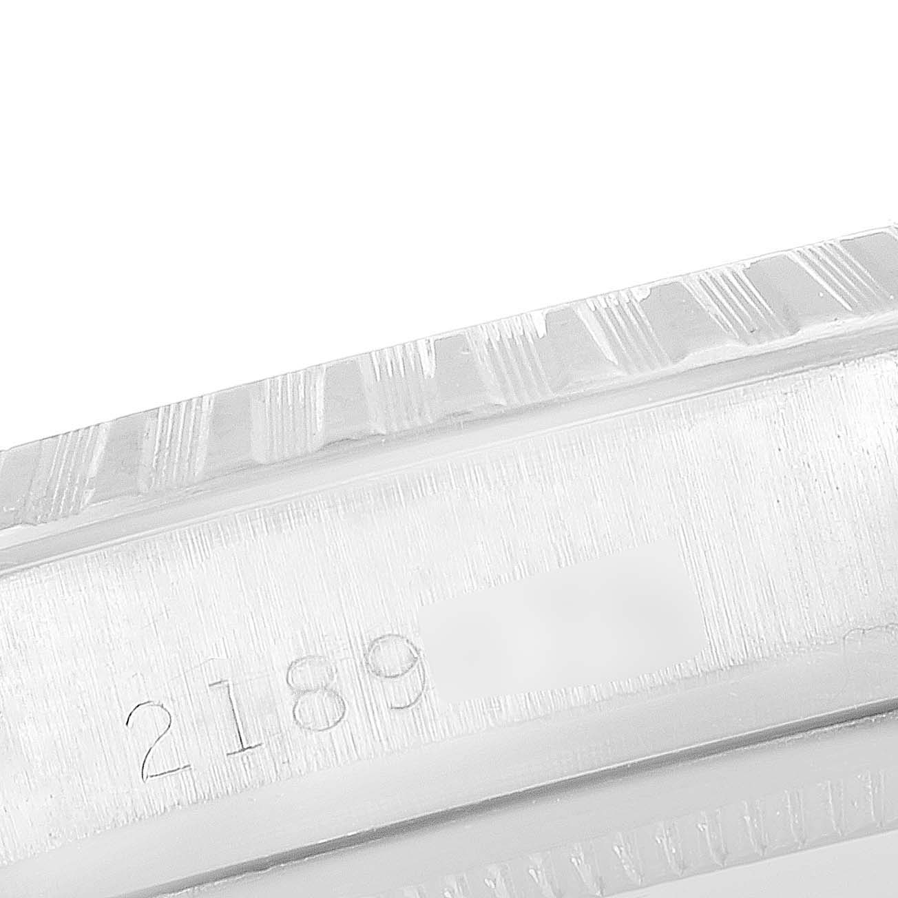 The image shows a close-up angle of the serial number and part of the bezel of the Rolex Vintage Collection 1601 Men's Stainless Steel Blue Dial 1601 Men's Stainless Steel Blue Dial model watch.