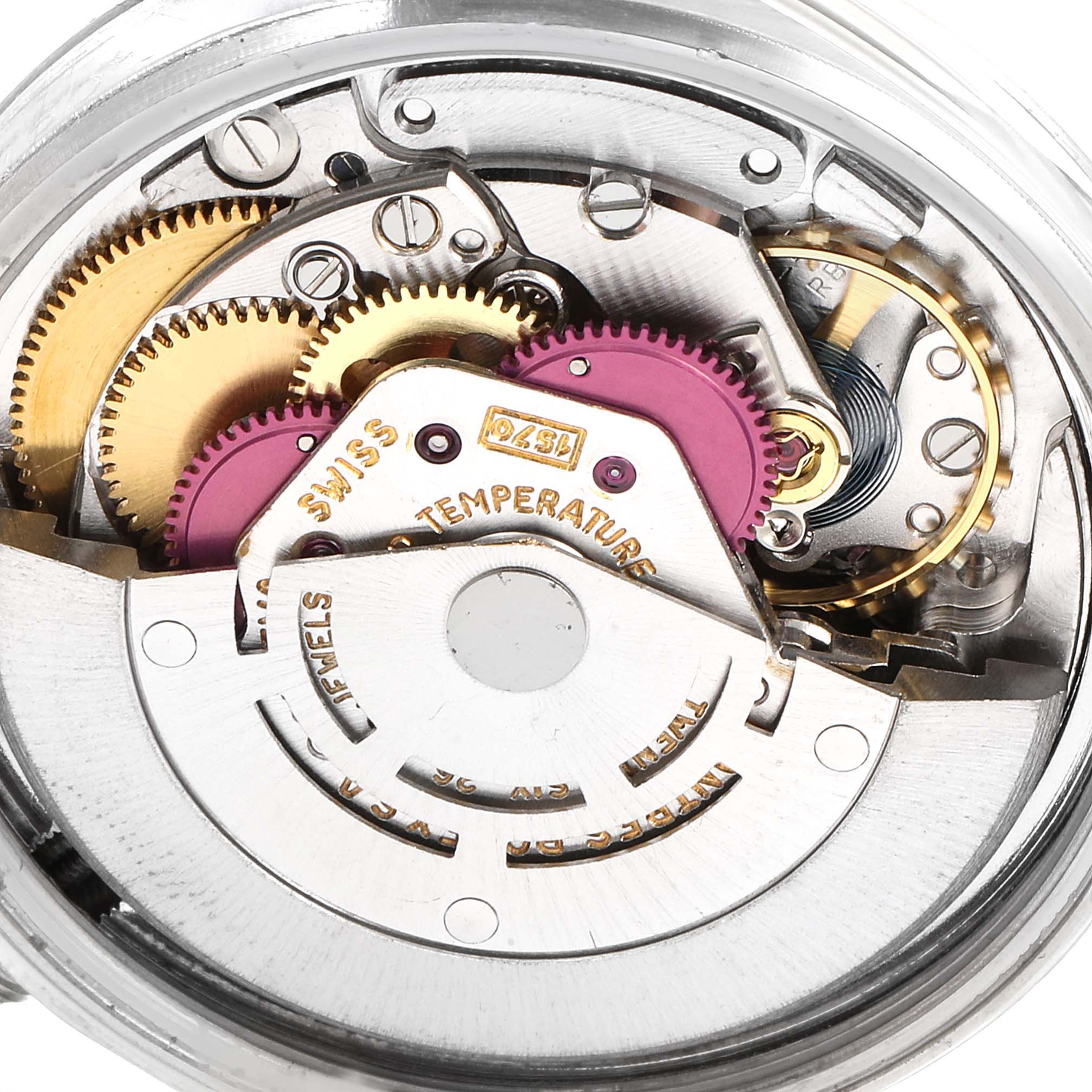 This close-up image shows the intricate inner workings of a Rolex Vintage Collection 1601 Men's Stainless Steel Blue Dial 1601 Men's Stainless Steel Blue Dial watch, emphasizing gears and mechanical parts.