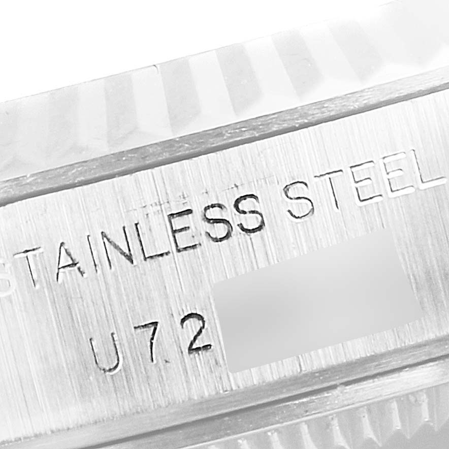 The image shows a close-up of the etched "STAINLESS STEEL" text on the casing of a Rolex Datejust 69174 Women's Stainless Steel Silver Dial 69174 Women's Stainless Steel Silver Dial watch.