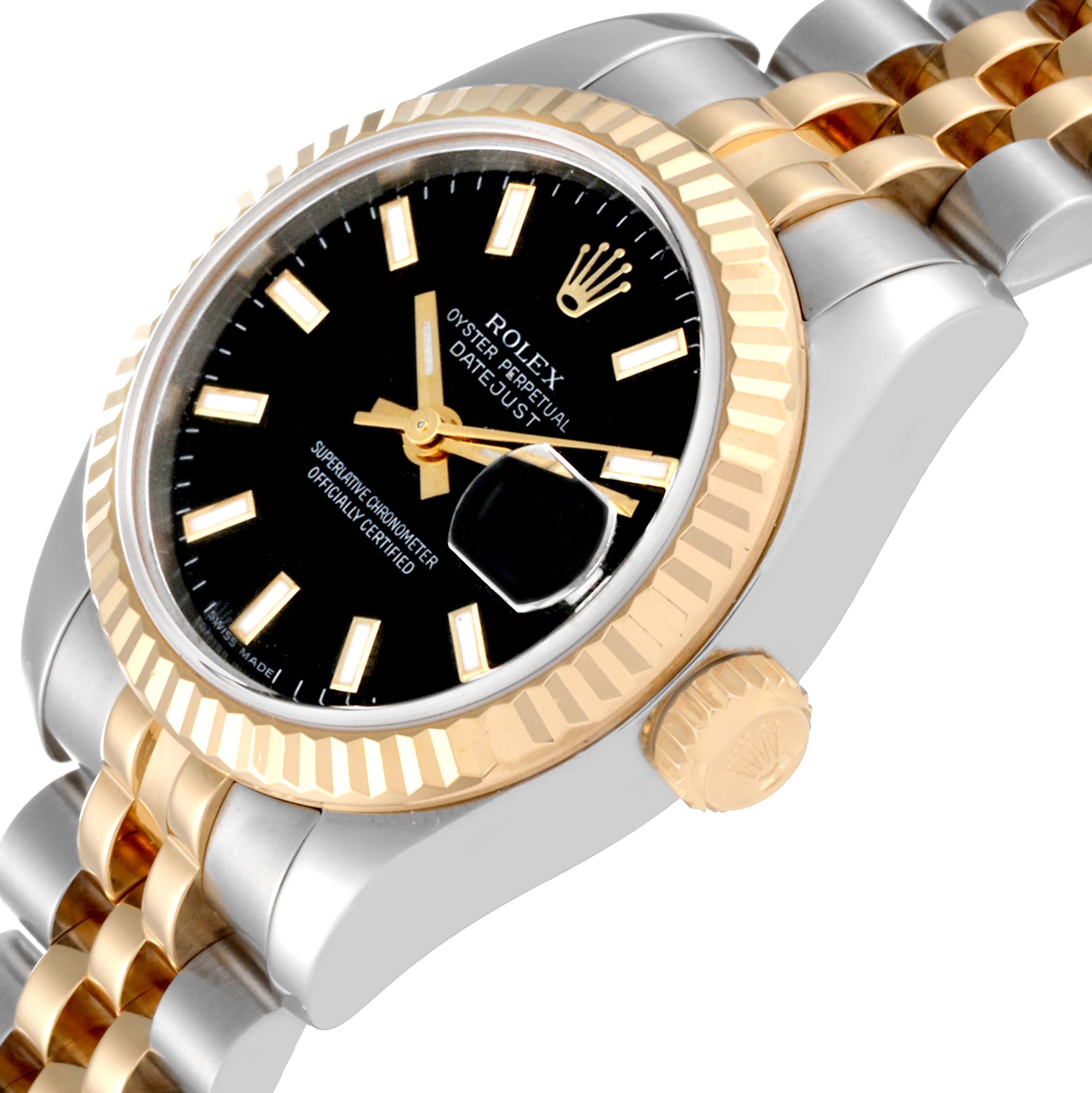 This image shows a close-up of a Rolex Datejust 179173 Women's Steel and Gold (two tone) Black Dial 179173 Women's Steel and Gold (two tone) Black Dial watch focusing on the black dial, gold fluted bezel, and two-tone bracelet.
