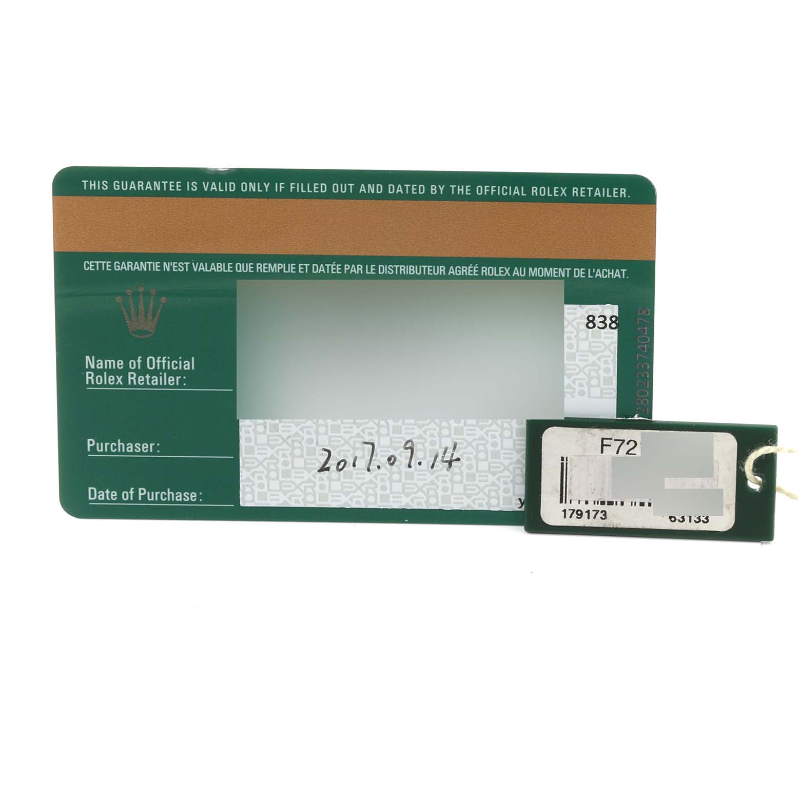 The image shows the guarantee card and tag for the Rolex Datejust 179173 Women's Steel and Gold (two tone) Black Dial 179173 Women's Steel and Gold (two tone) Black Dial model.