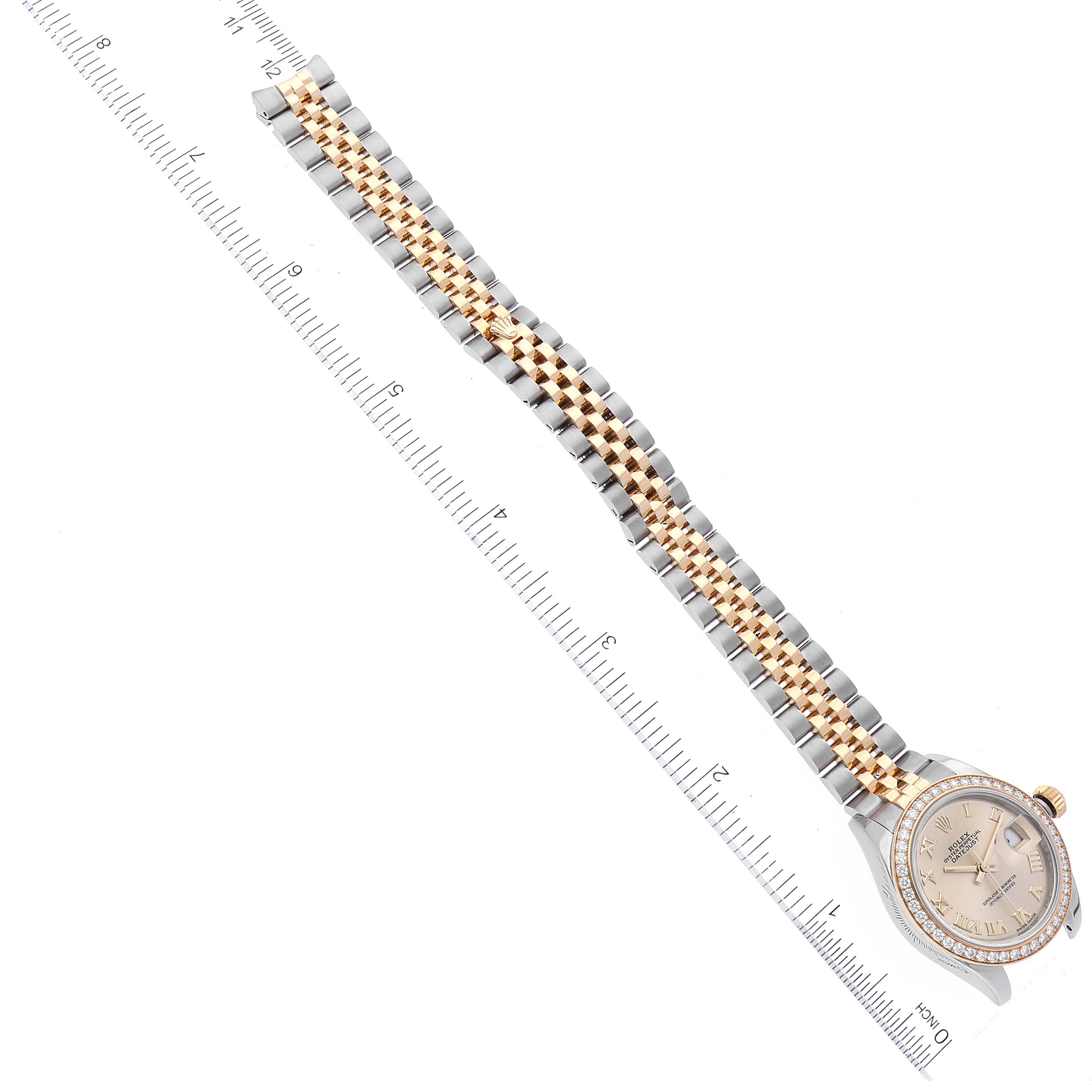 The image shows a Rolex Datejust 279383 Women's Steel and Gold (two tone) Champagne Dial 279383 Women's Steel and Gold (two tone) Champagne Dial watch from a top-down angle, displaying the full band and face, with a ruler for scale.