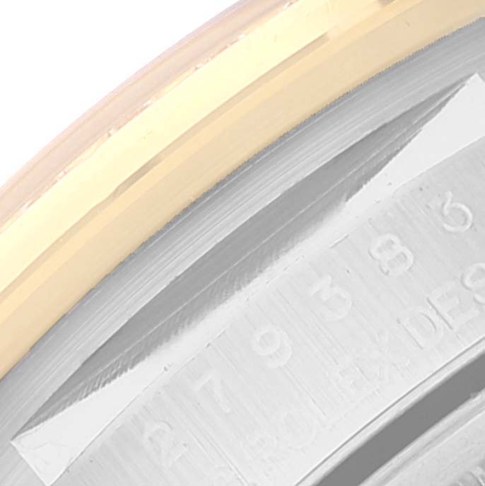 This image shows a close-up of the bezel and part of the engraved inner rim of a Rolex Datejust 279383 Women's Steel and Gold (two tone) Champagne Dial 279383 Women's Steel and Gold (two tone) Champagne Dial watch.