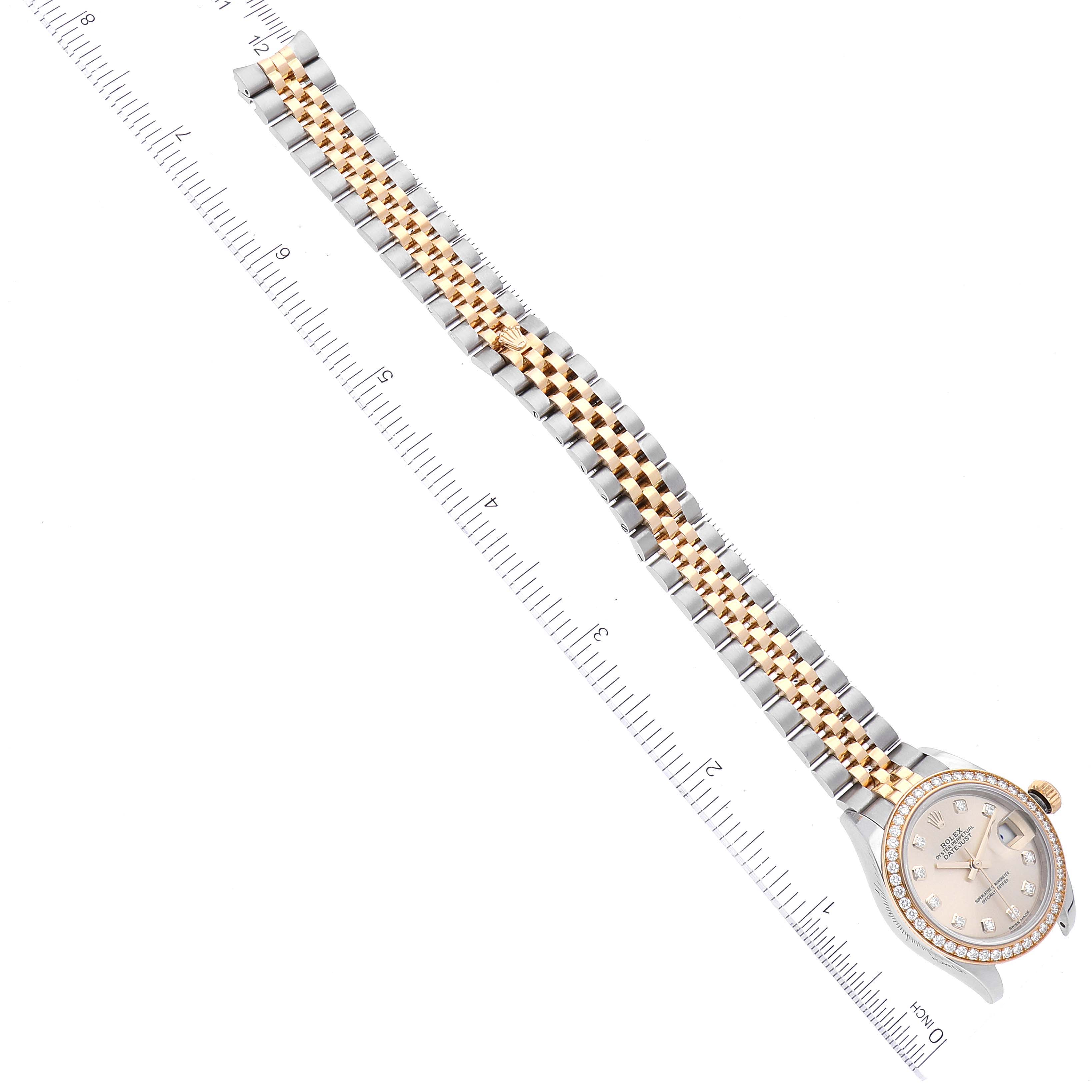 The image shows a Rolex Datejust 279383 Women's Steel and Gold (two tone) Champagne Dial 279383 Women's Steel and Gold (two tone) Champagne Dial watch from an overhead view, highlighting the face, bezel, and two-tone bracelet with a ruler for scale.