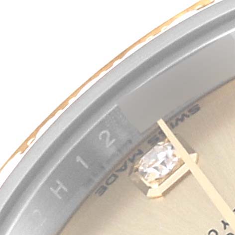 This image shows a partial close-up of the dial and bezel of a Rolex Datejust 279383 Women's Steel and Gold (two tone) Champagne Dial 279383 Women's Steel and Gold (two tone) Champagne Dial watch, focusing on the 12 o'clock position.