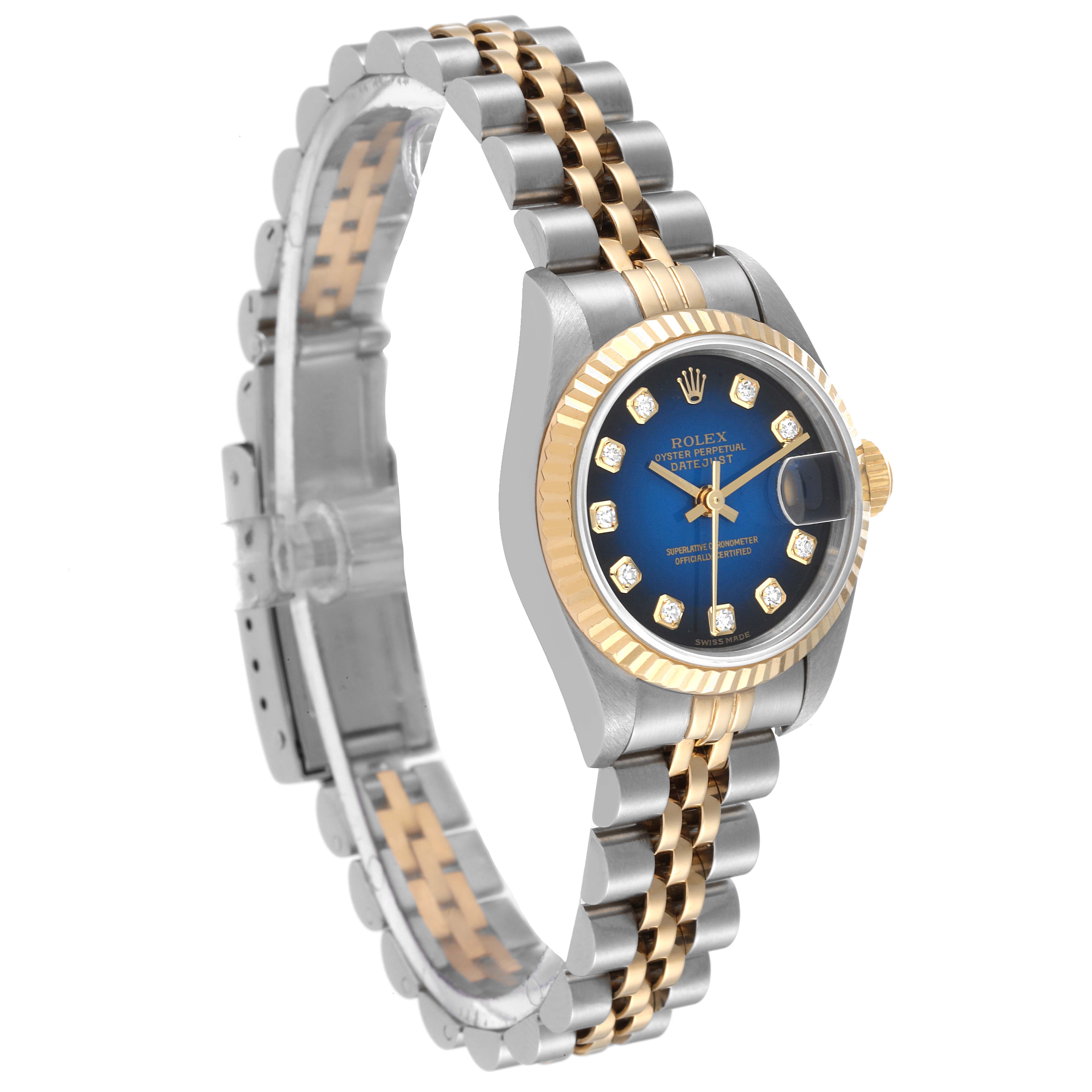 This Rolex Datejust 79173 Women's Steel and Gold (two tone) Blue Dial 79173 Women's Steel and Gold (two tone) Blue Dial watch is shown at an angled view highlighting its two-tone bracelet, blue dial, and fluted bezel.
