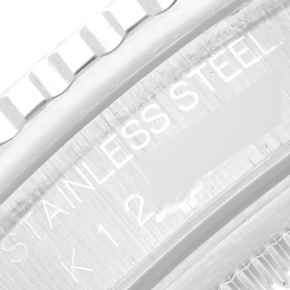 The image shows a close-up of the bezel and case back of the Rolex Turn-o-Graph 16264 Men's Stainless Steel Black Dial 16264 Men's Stainless Steel Black Dial watch, highlighting the "STAINLESS STEEL" engraving.