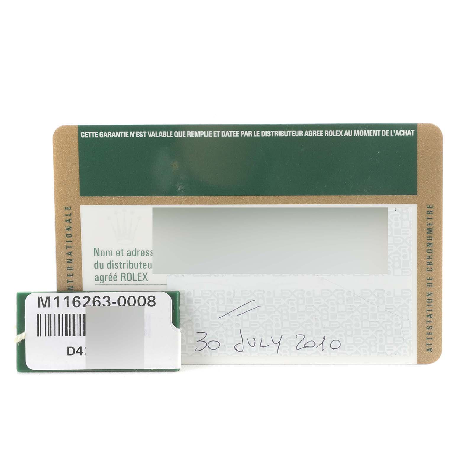 This image shows the warranty card and a tag for the Rolex Turn-o-Graph 116263 Men's Steel and Gold (two tone) Champagne Dial 116263 Men's Steel and Gold (two tone) Champagne Dial model.