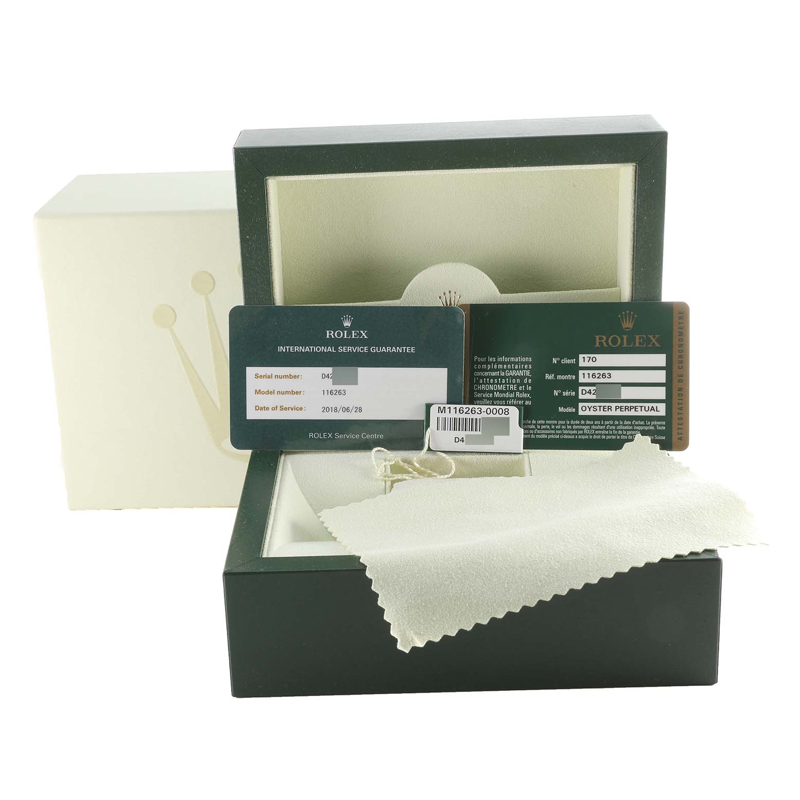 The image shows the accessories and box of a Rolex Turn-o-Graph 116263 Men's Steel and Gold (two tone) Champagne Dial 116263 Men's Steel and Gold (two tone) Champagne Dial, including service guarantee cards, a tag, and a cleaning cloth.