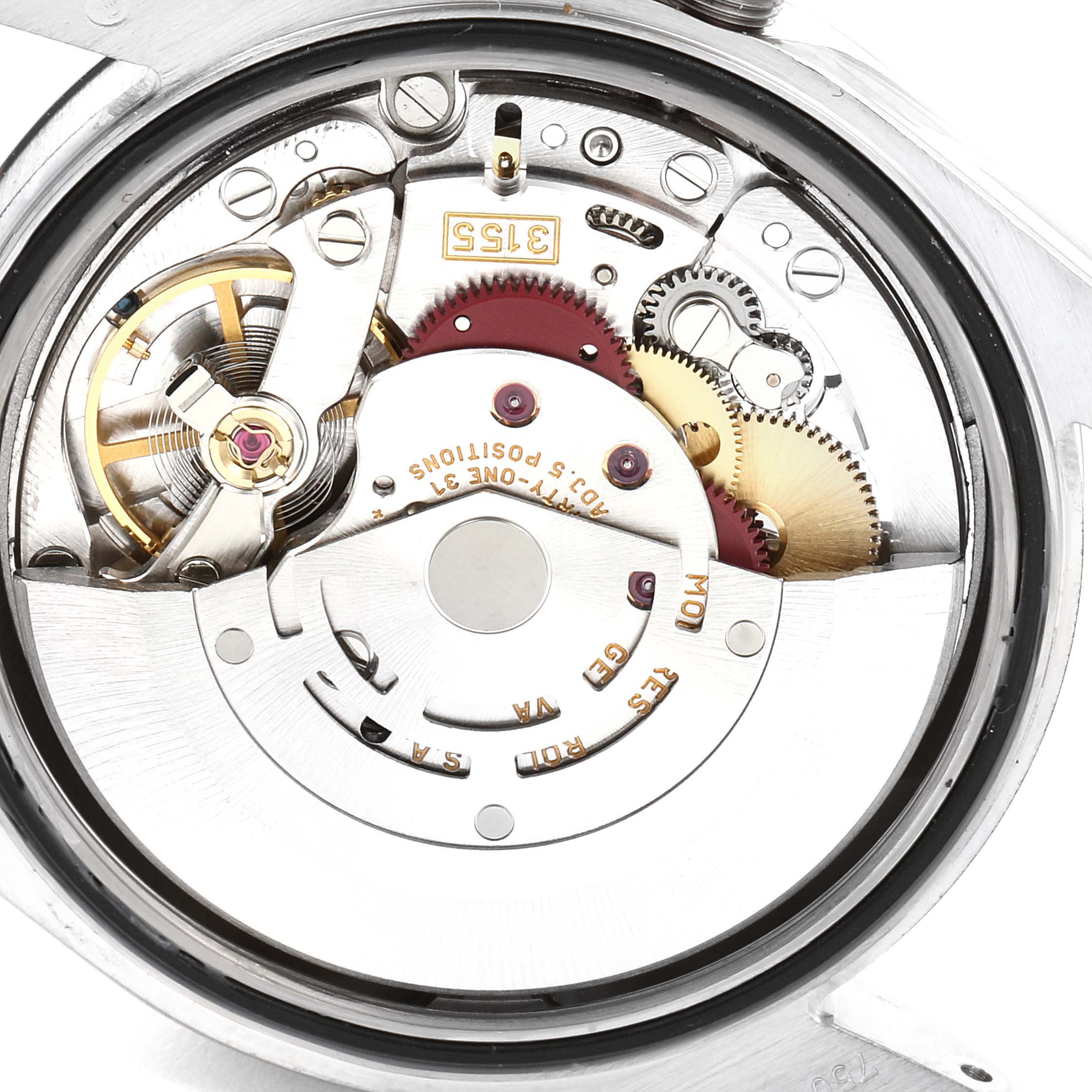 This image shows the inner mechanism of a Rolex President 118239 Men
s White Gold Silver Dial 118239 Men
s White Gold Silver Dial model watch from a close-up angle, revealing gears and the winding mechanism.