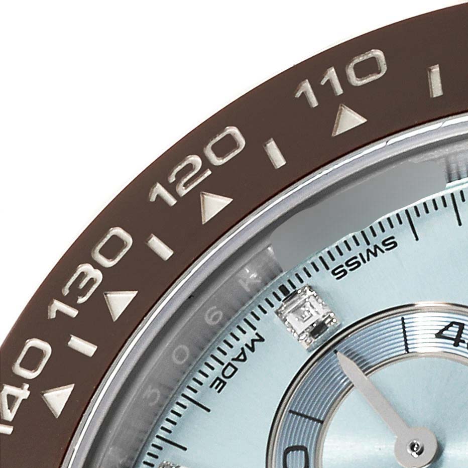The image shows a close-up of the bezel and part of the dial of a Rolex Daytona 116506 Men's Platinum Blue Dial 116506 Men's Platinum Blue Dial watch.