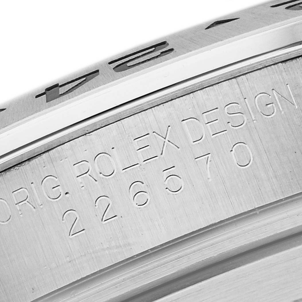 The image shows a close-up view of the engraved bezel and part of the casing of a Rolex Explorer 226570 Men
s Stainless Steel Black Dial 226570 Men
s Stainless Steel Black Dial watch with the model number.