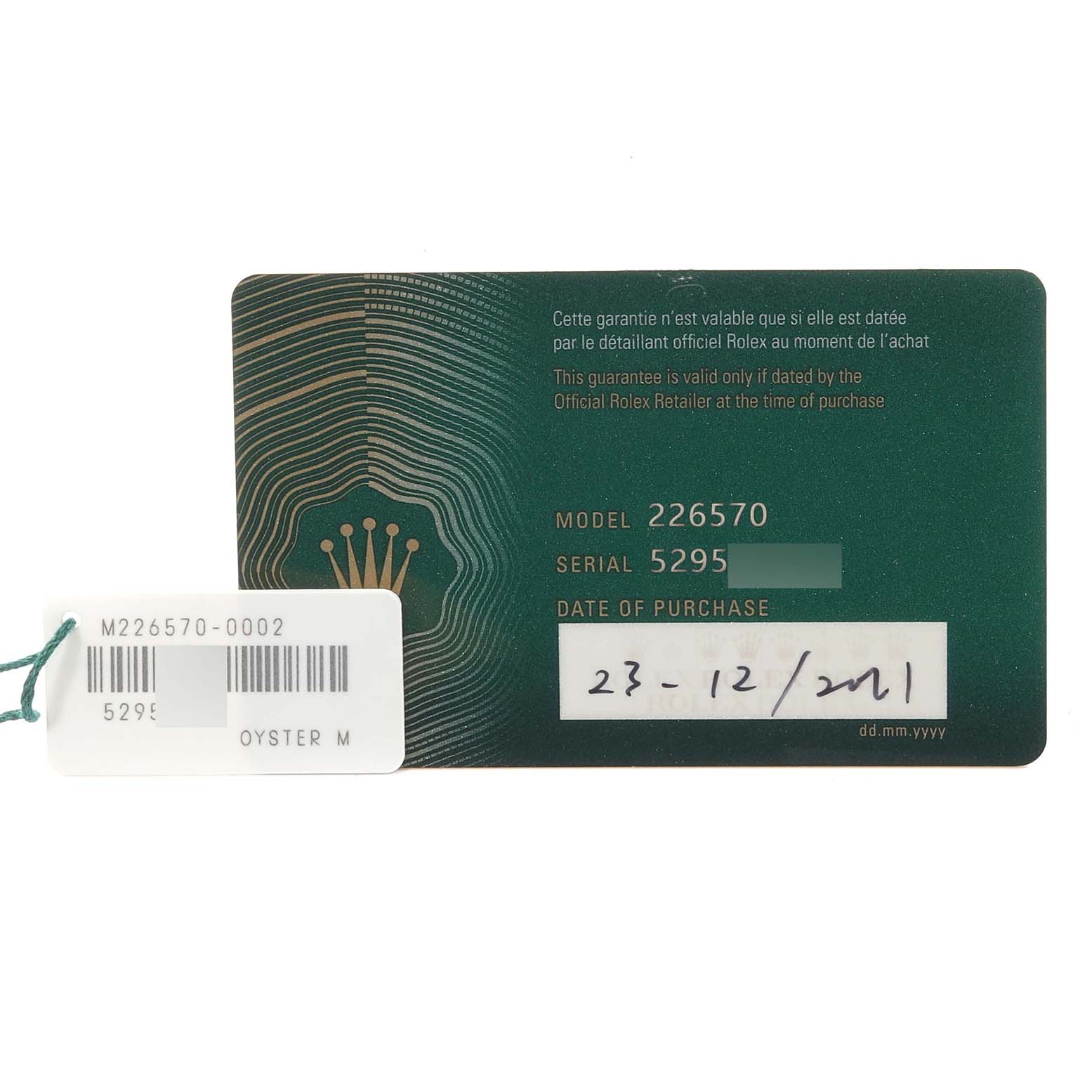 The image shows a warranty card for a Rolex Explorer M226570-0002 Men's Stainless Steel Black Dial M226570-0002 Men's Stainless Steel Black Dial model 226570, including the serial number and date of purchase.