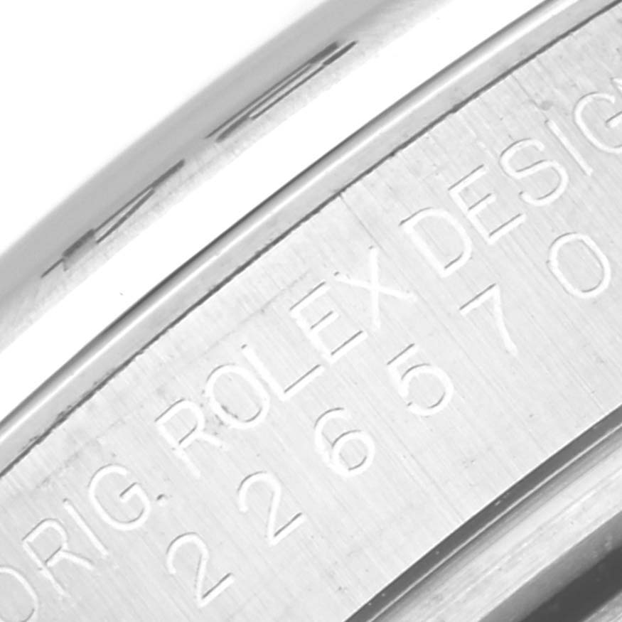 This close-up image shows the engraved serial number and inscription on the case of a Rolex Explorer M226570-0002 Men's Stainless Steel Black Dial M226570-0002 Men's Stainless Steel Black Dial watch.