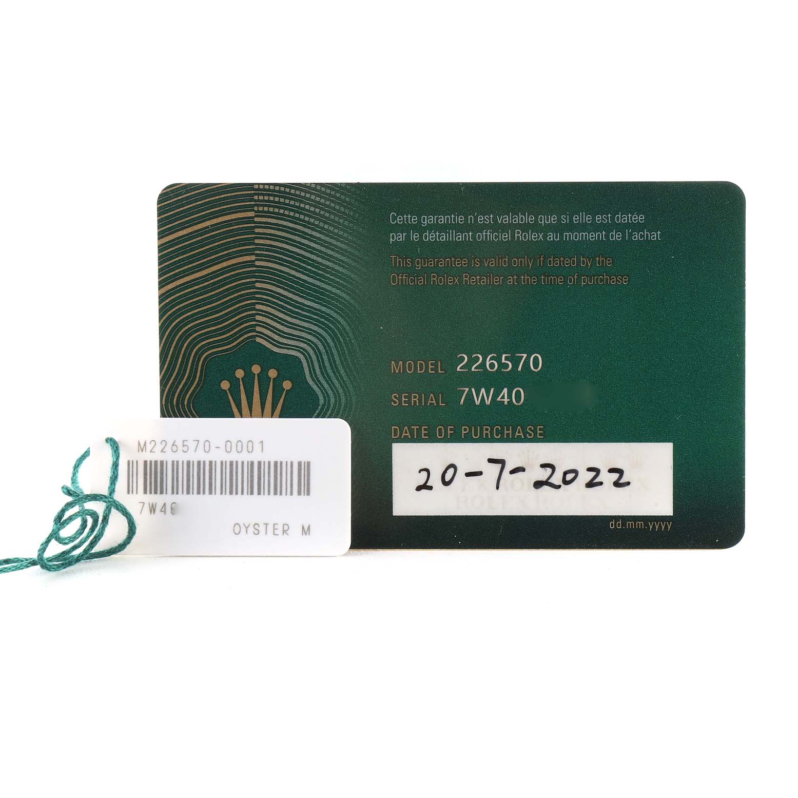 The image shows warranty cards and tags for a Rolex Explorer 226570 Men
s Stainless Steel White Dial 226570 Men
s Stainless Steel White Dial model 226570 with the serial number 7W40 and a purchase date of 20-7-2022.