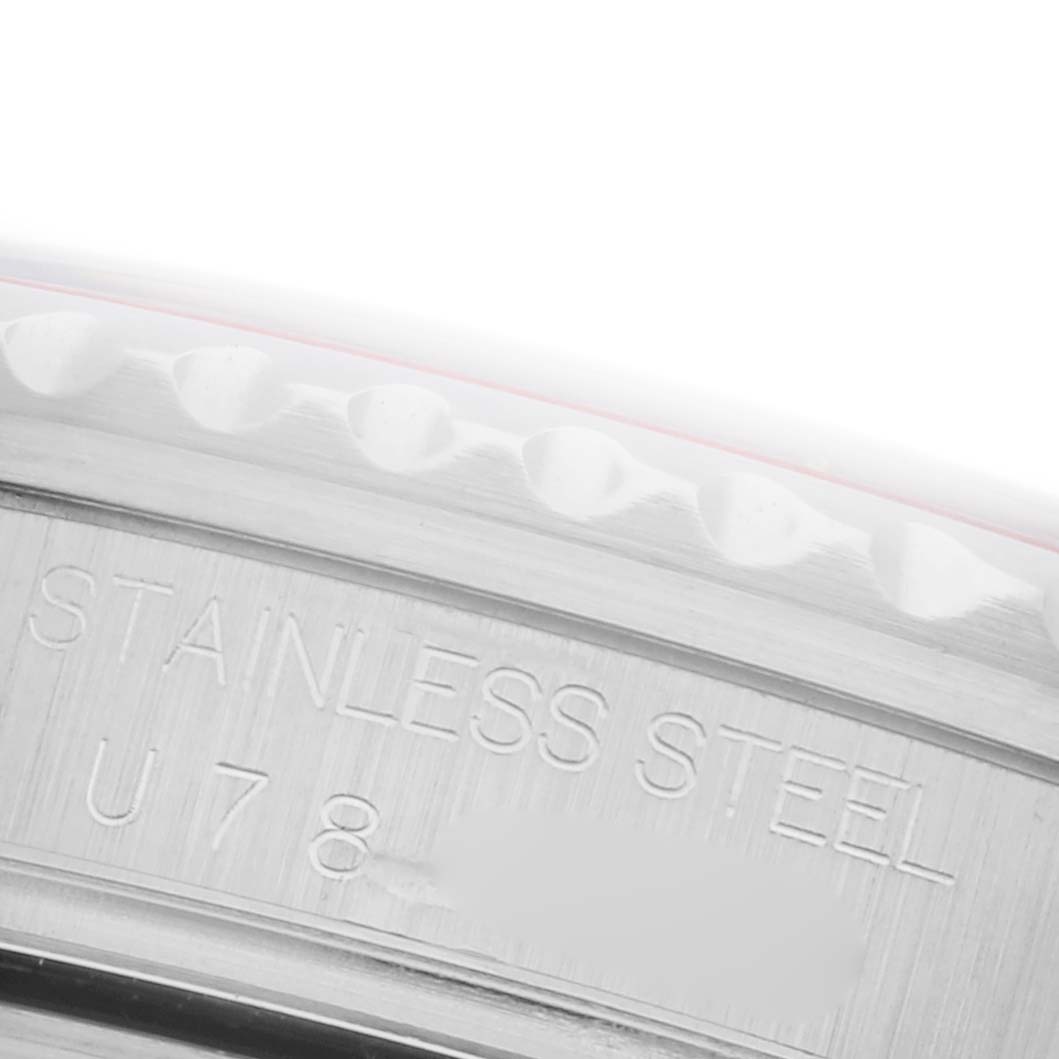 The image shows a close-up of the stainless steel rear case of a Rolex GMT-Master 16710 Men
s Stainless Steel Black Dial 16710 Men
s Stainless Steel Black Dial watch.