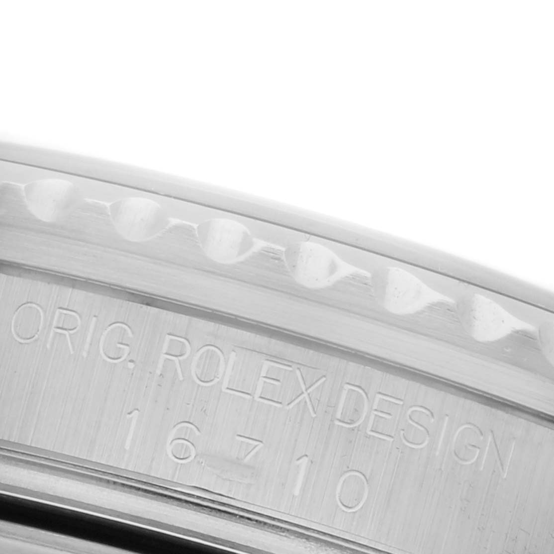 The image shows a close-up of the side engraving on the case of a Rolex GMT-Master 16710 Men
s Stainless Steel Black Dial 16710 Men
s Stainless Steel Black Dial, displaying the model number.