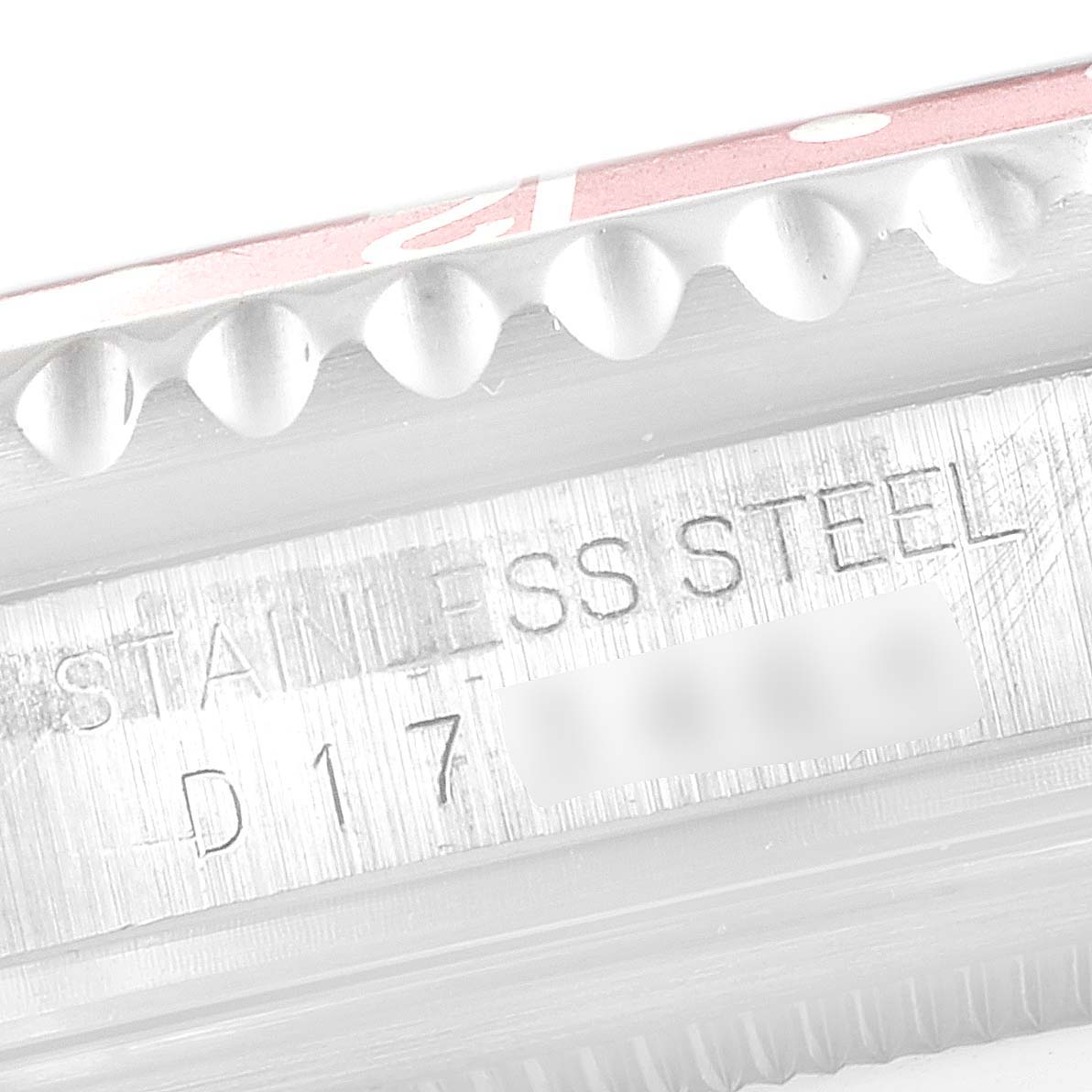 The image shows a close-up side view of the bezel and case with the serial number of a Rolex GMT-Master 16710 Men's Stainless Steel Black Dial 16710 Men's Stainless Steel Black Dial watch.