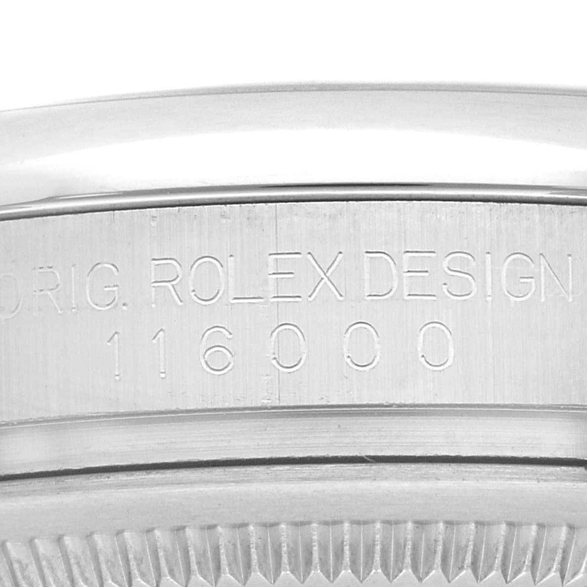 This image shows a close-up of the serial number engraved on the case of a Rolex Oyster Perpetual 116000 Men
s Stainless Steel Silver Dial 116000 Men
s Stainless Steel Silver Dial watch.