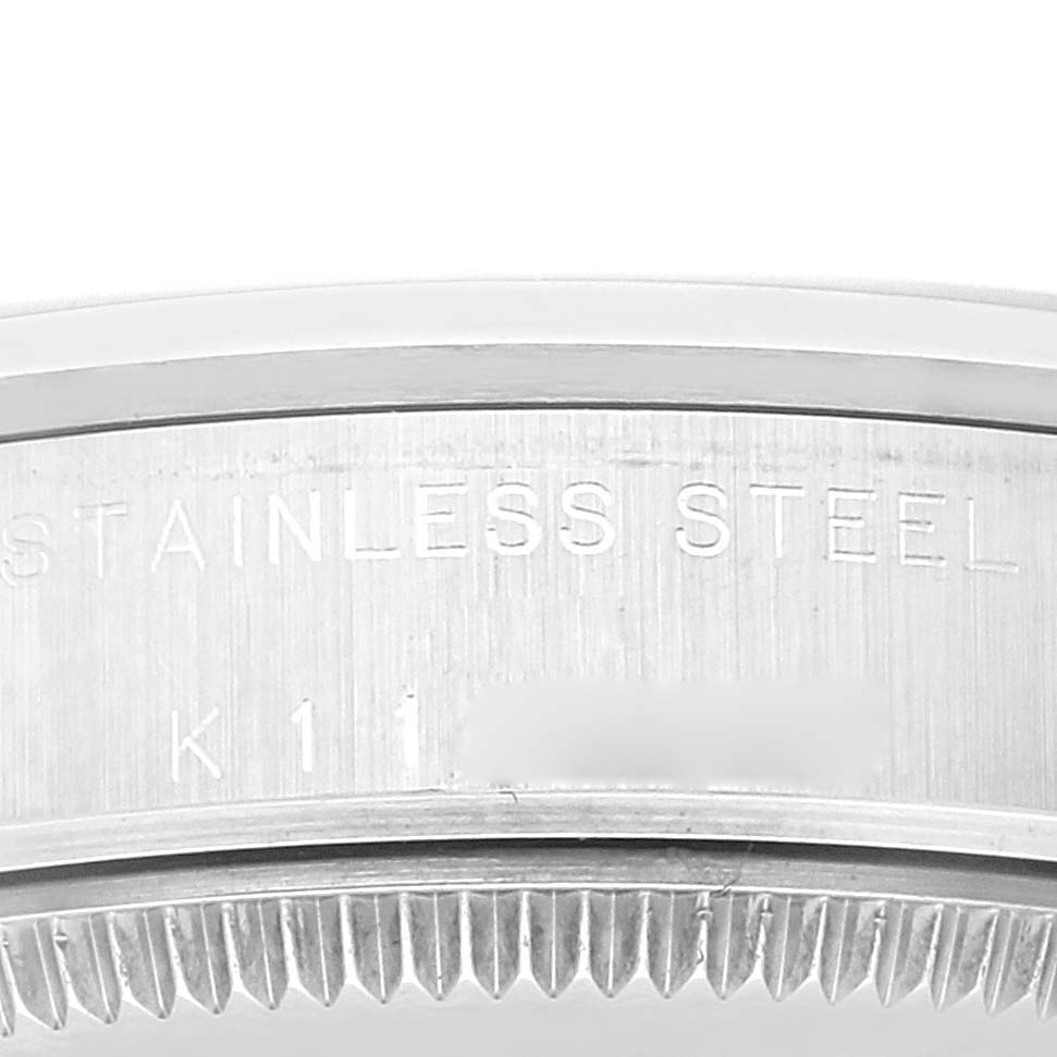 This image shows a close-up view of the stainless steel case back of a Rolex Mid-Size 77080 Women
s Stainless Steel Blue Dial 77080 Women
s Stainless Steel Blue Dial model.