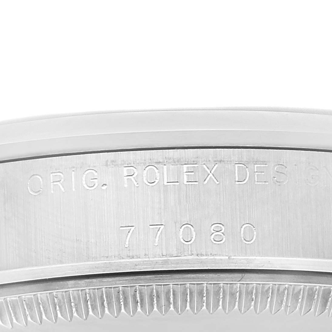 This image shows a close-up of the case side of a Mid-Size Rolex watch, highlighting the engraved model number and origin design details.