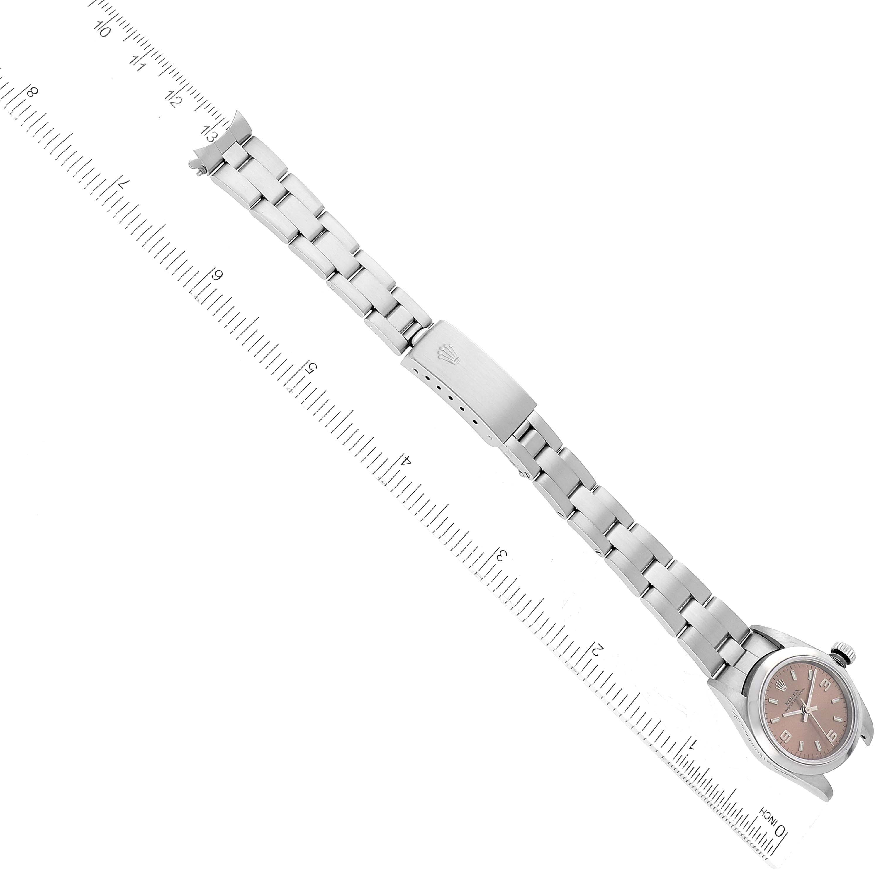 The image shows the entire Rolex Oyster Perpetual 76080 Women's Stainless Steel Pink Dial 76080 Women's Stainless Steel Pink Dial watch from a top view, including the dial, bracelet, and clasp.