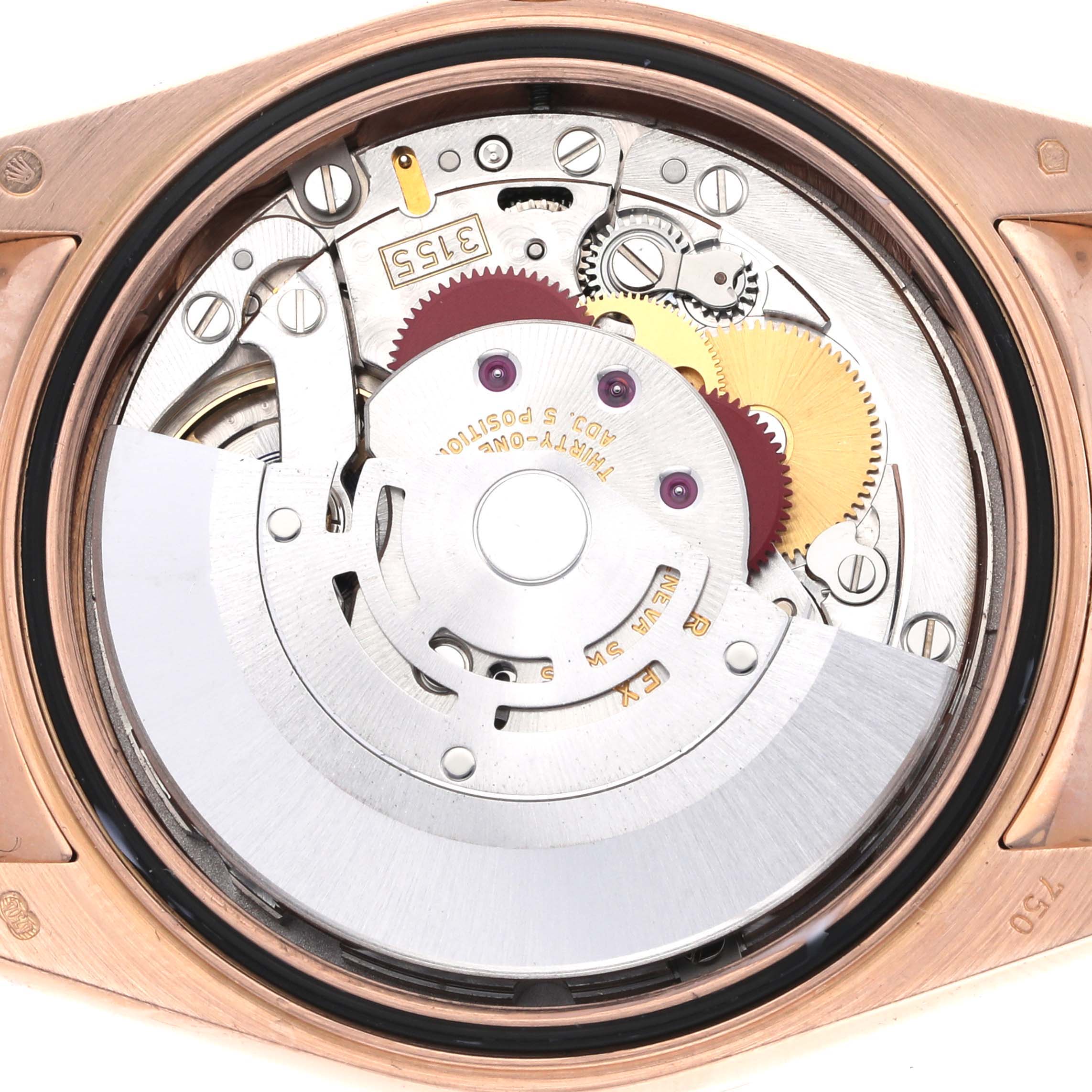 The image shows the movement mechanism of a Rolex President 118135 Men
s Rose Gold Brown Dial 118135 Men
s Rose Gold Brown Dial watch viewed from the back, displaying gears and other components.