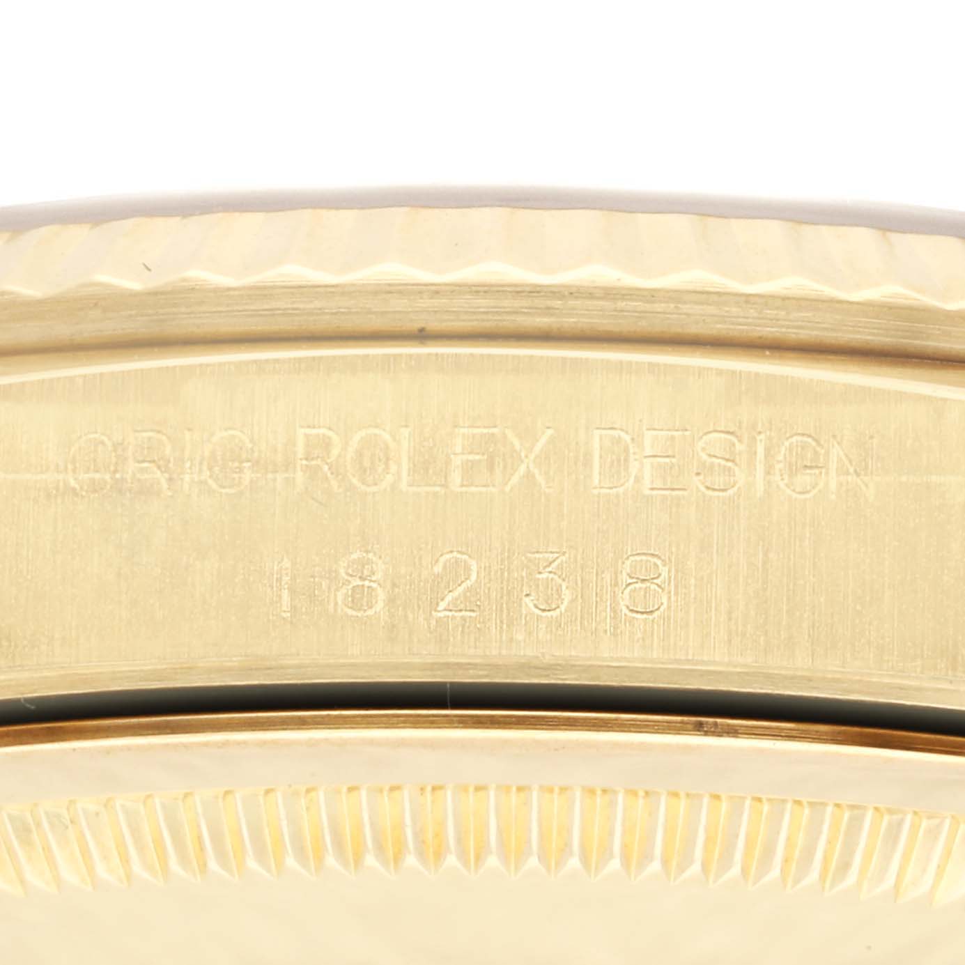 This close-up angle shows the side view of the Rolex President 18238 Men
s Yellow Gold Silver Dial 18238 Men
s Yellow Gold Silver Dial model, highlighting the engravings on the case.