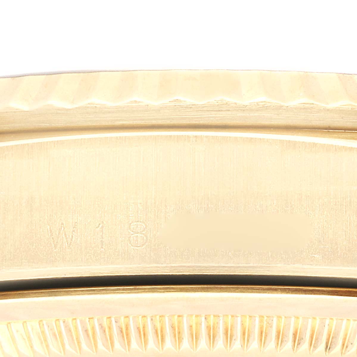 This image shows a close-up of the case and fluted bezel of a Rolex President 18238 Men
s Yellow Gold Silver Dial 18238 Men
s Yellow Gold Silver Dial model watch.