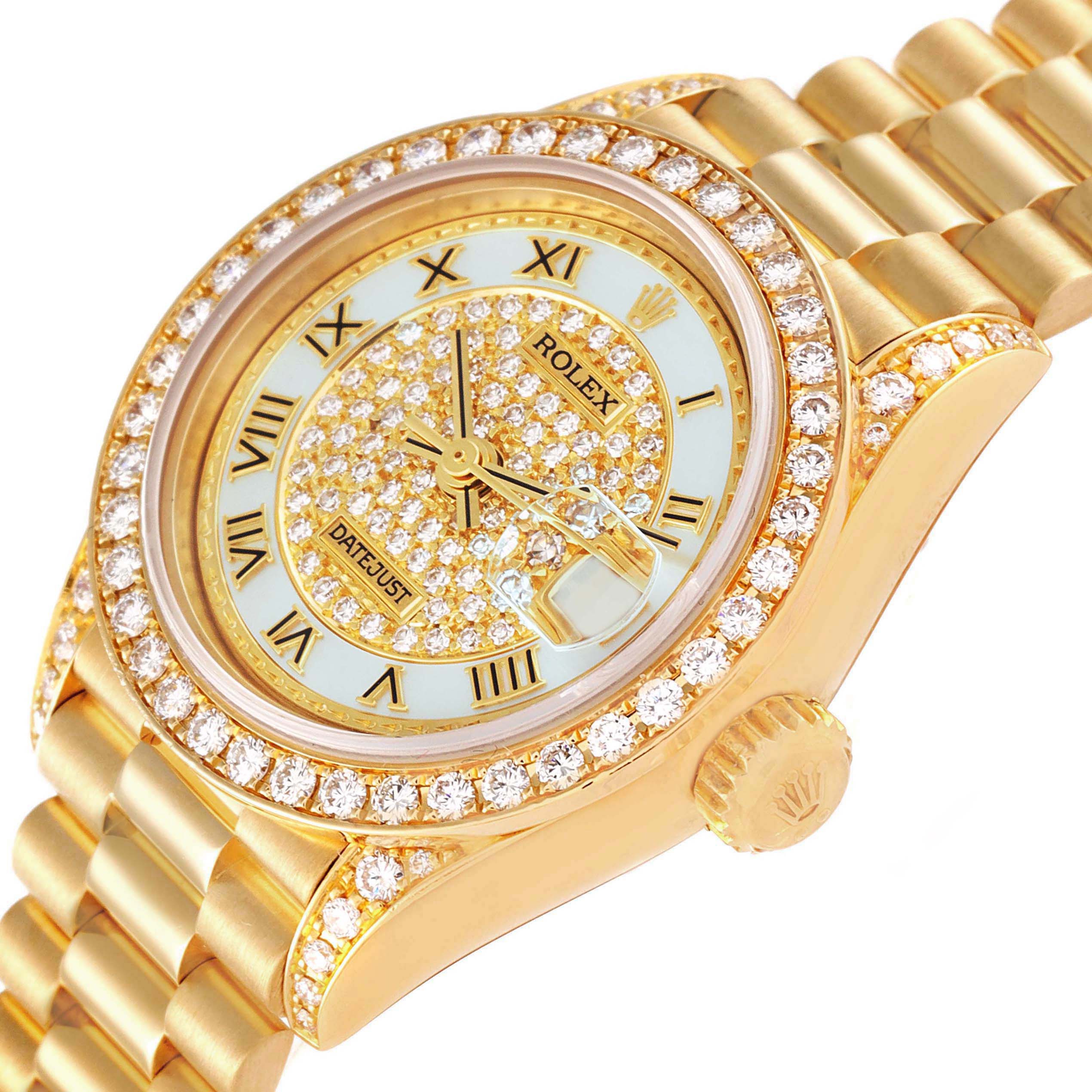 This Rolex President 69158 Women's Yellow Gold Mother of Pearl Dial 69158 Women's Yellow Gold Mother of Pearl Dial model watch is shown at an angle highlighting the dial, diamond bezel, crown, and part of the bracelet.