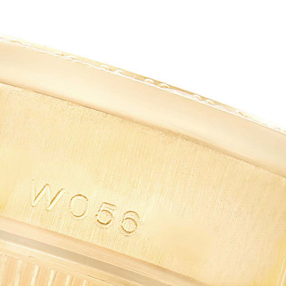 This image shows a close-up view of the engraved serial number on the case back of a Rolex President 69158 Women's Yellow Gold Mother of Pearl Dial 69158 Women's Yellow Gold Mother of Pearl Dial model watch.
