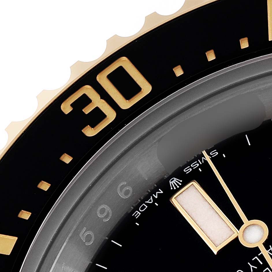 This image shows a close-up of the bezel and part of the dial of a Rolex Sea-Dweller M126603 Men
s Steel and Gold (two tone) Black Dial M126603 Men
s Steel and Gold (two tone) Black Dial watch, highlighting the "30" marker and minute hand.
