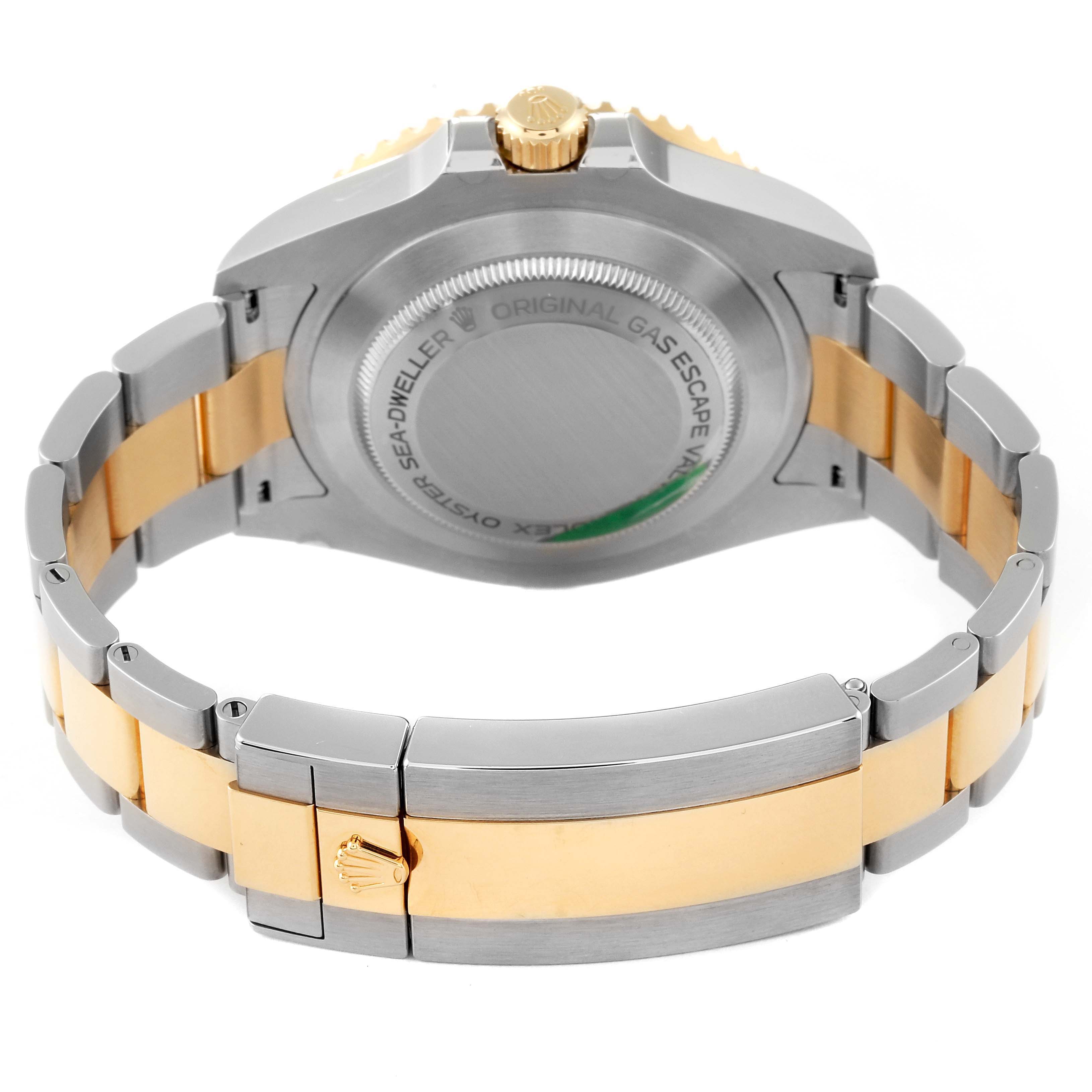 The image shows the back and bracelet of a Rolex Sea-Dweller M126603 Men
s Steel and Gold (two tone) Black Dial M126603 Men
s Steel and Gold (two tone) Black Dial watch, highlighting the two-tone metal links and clasp.