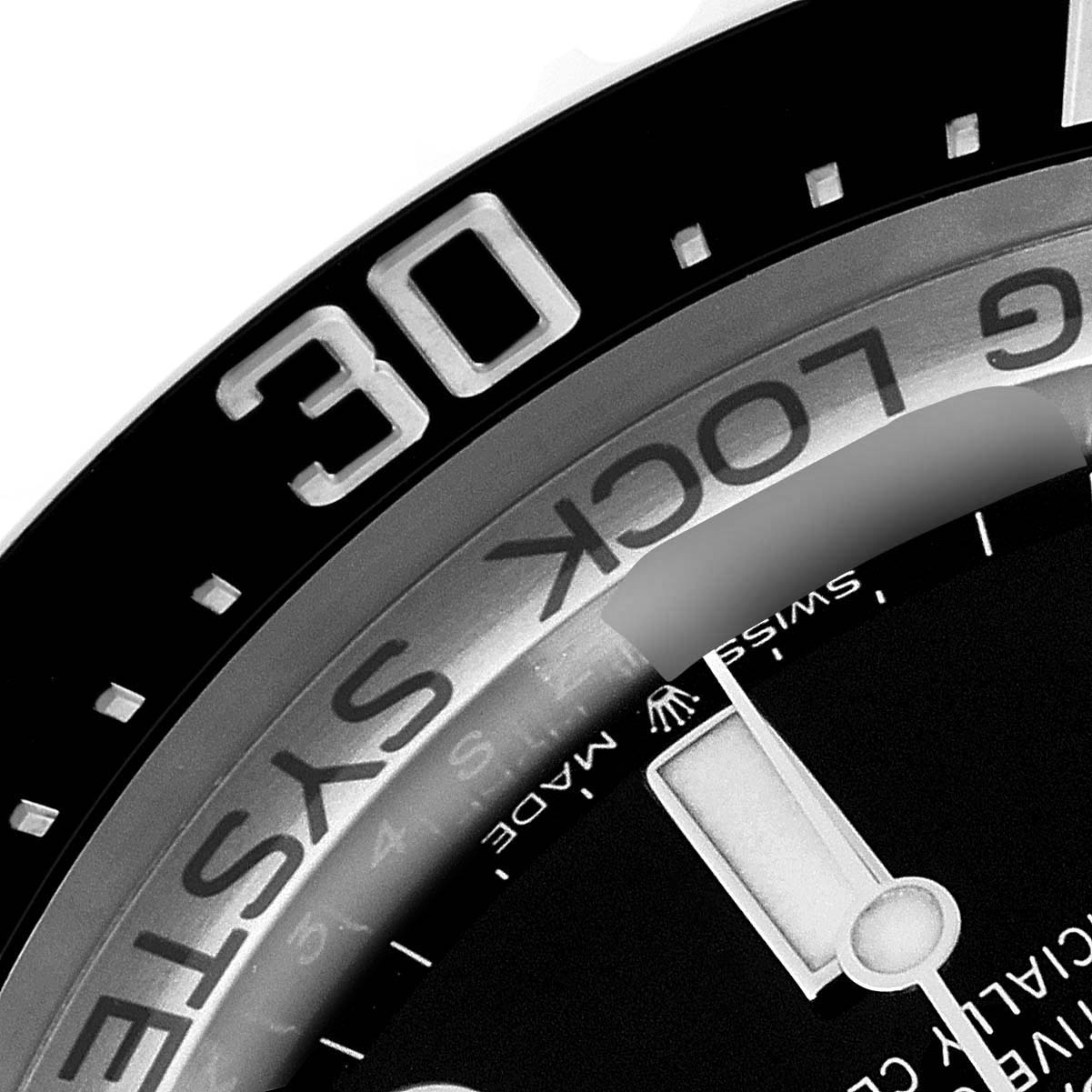 This image shows a close-up of the bezel, part of the dial, and the hand of a Rolex Sea-Dweller 126660 Men
s Stainless Steel Black Dial 126660 Men
s Stainless Steel Black Dial watch.